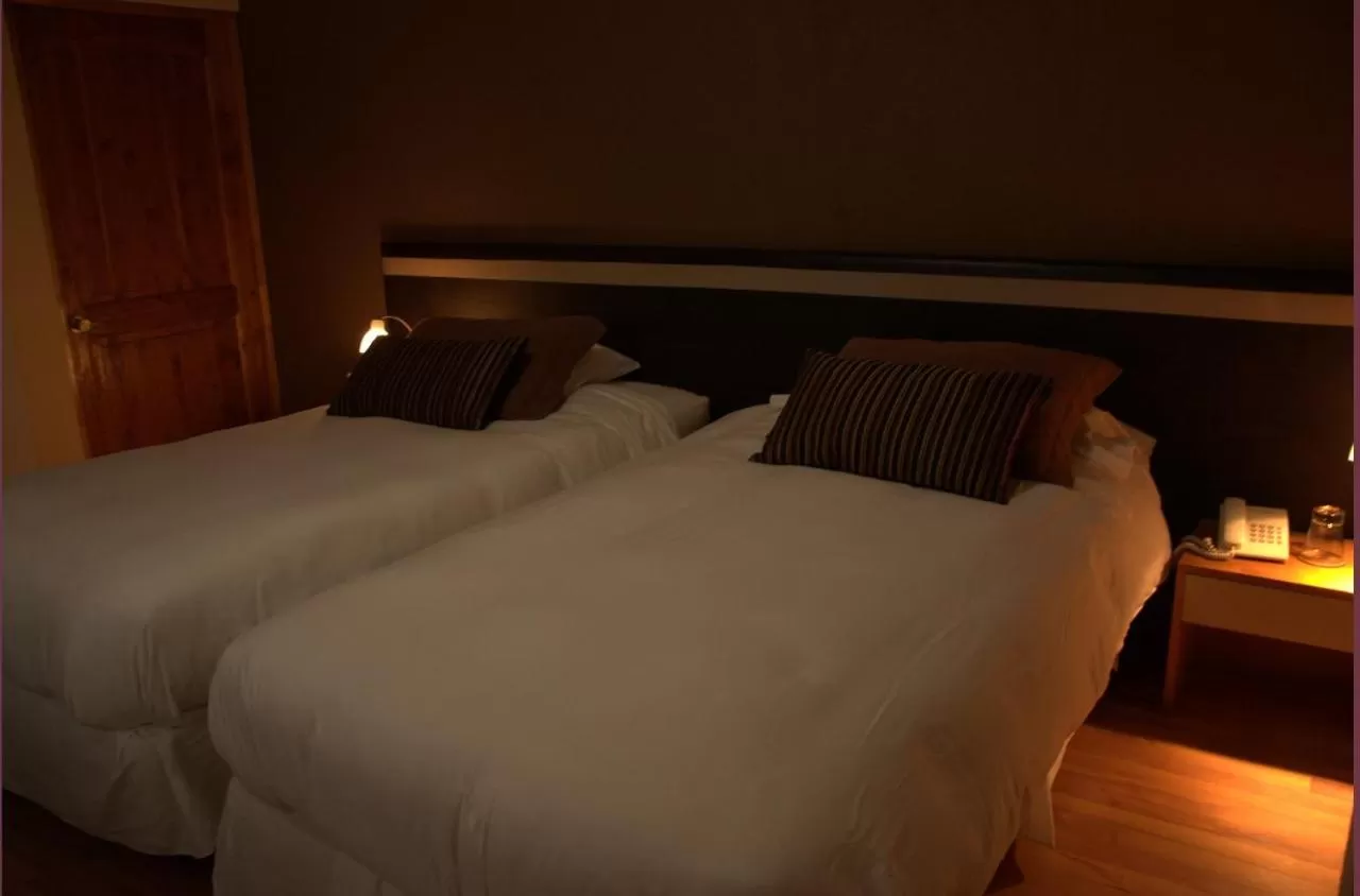 Bed in Hotel Puerto de Vega