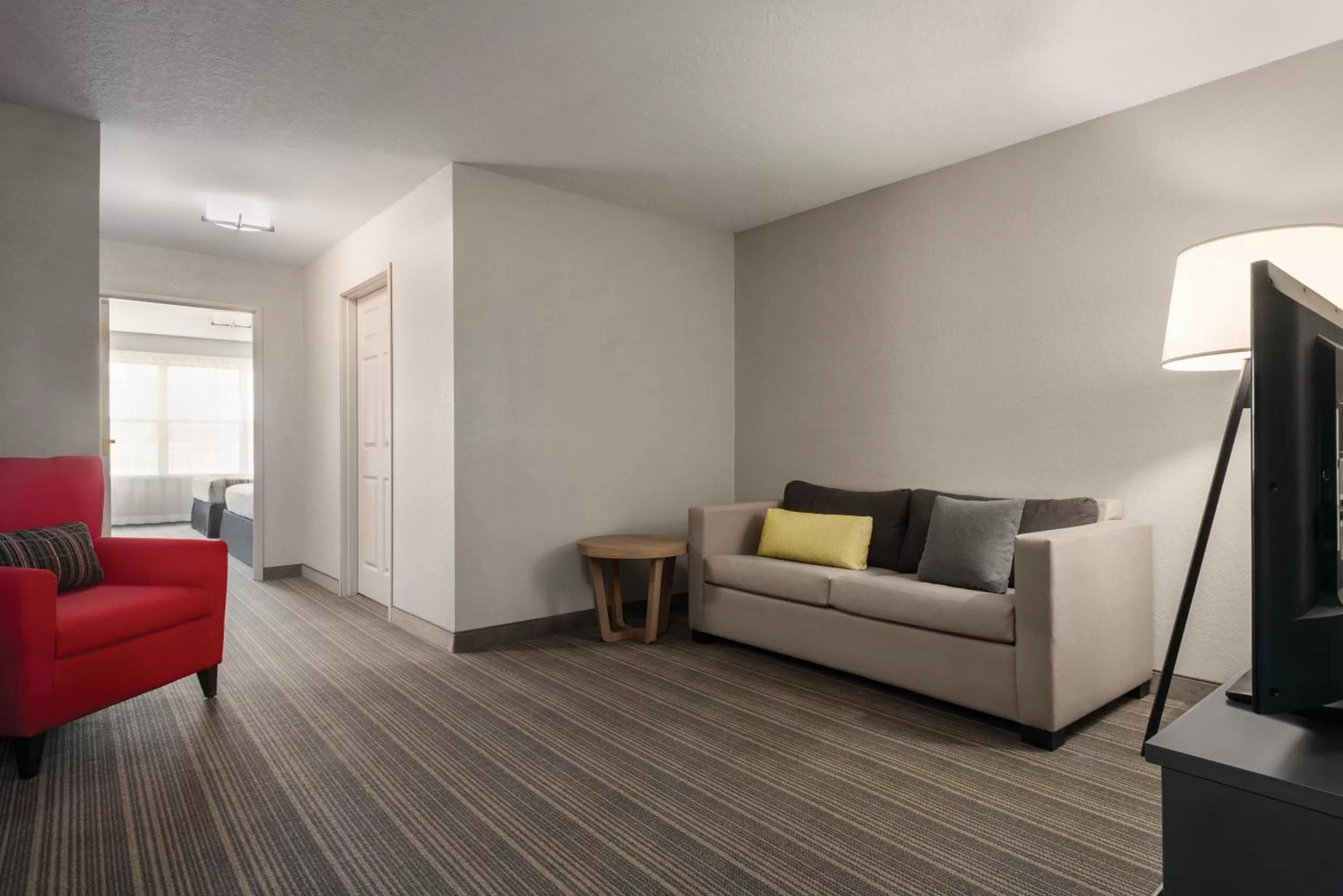 Living room in Country Inn & Suites by Radisson, Green Bay East, WI