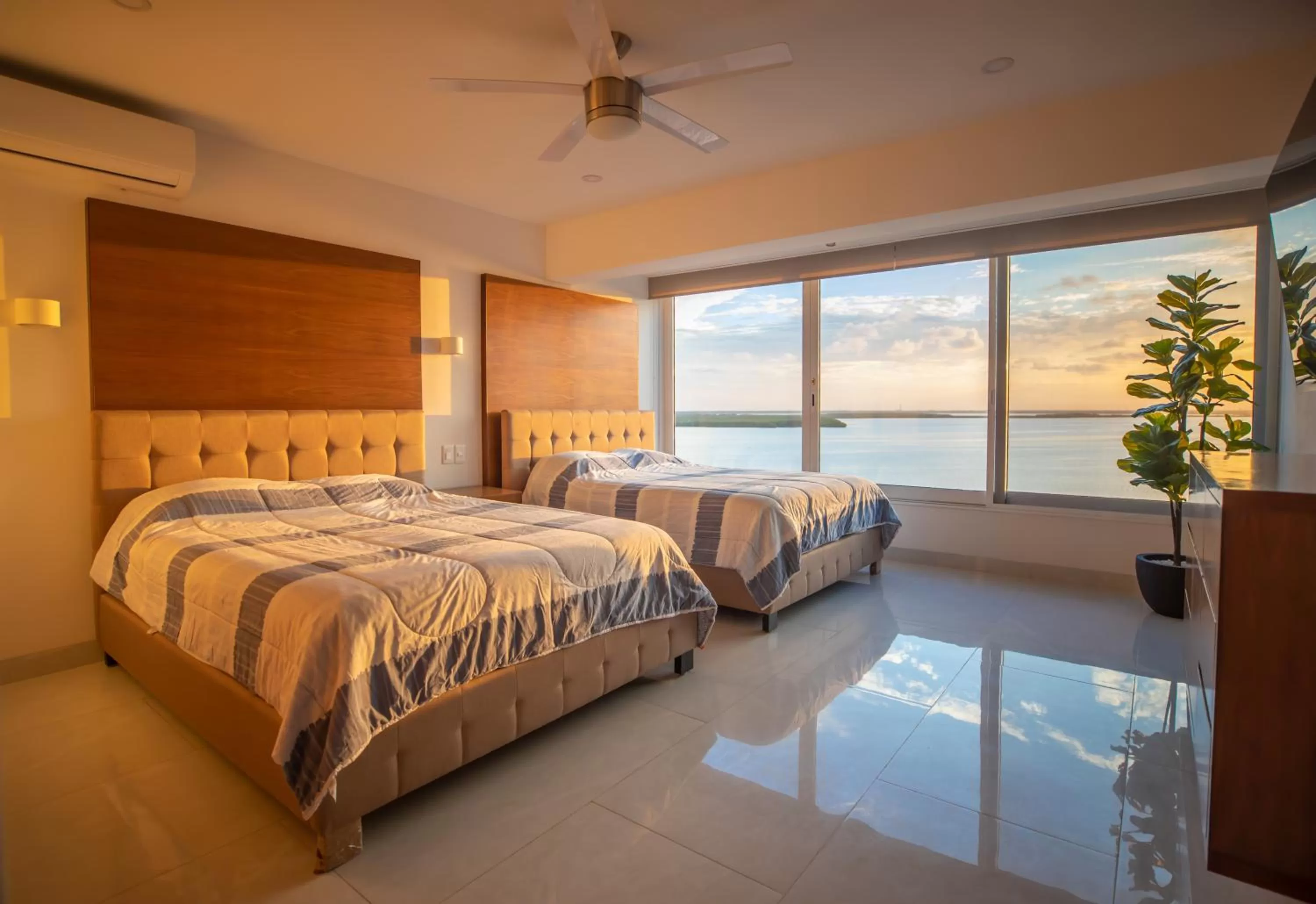Bed in Beachfront Penthouses by LivIN Cancun