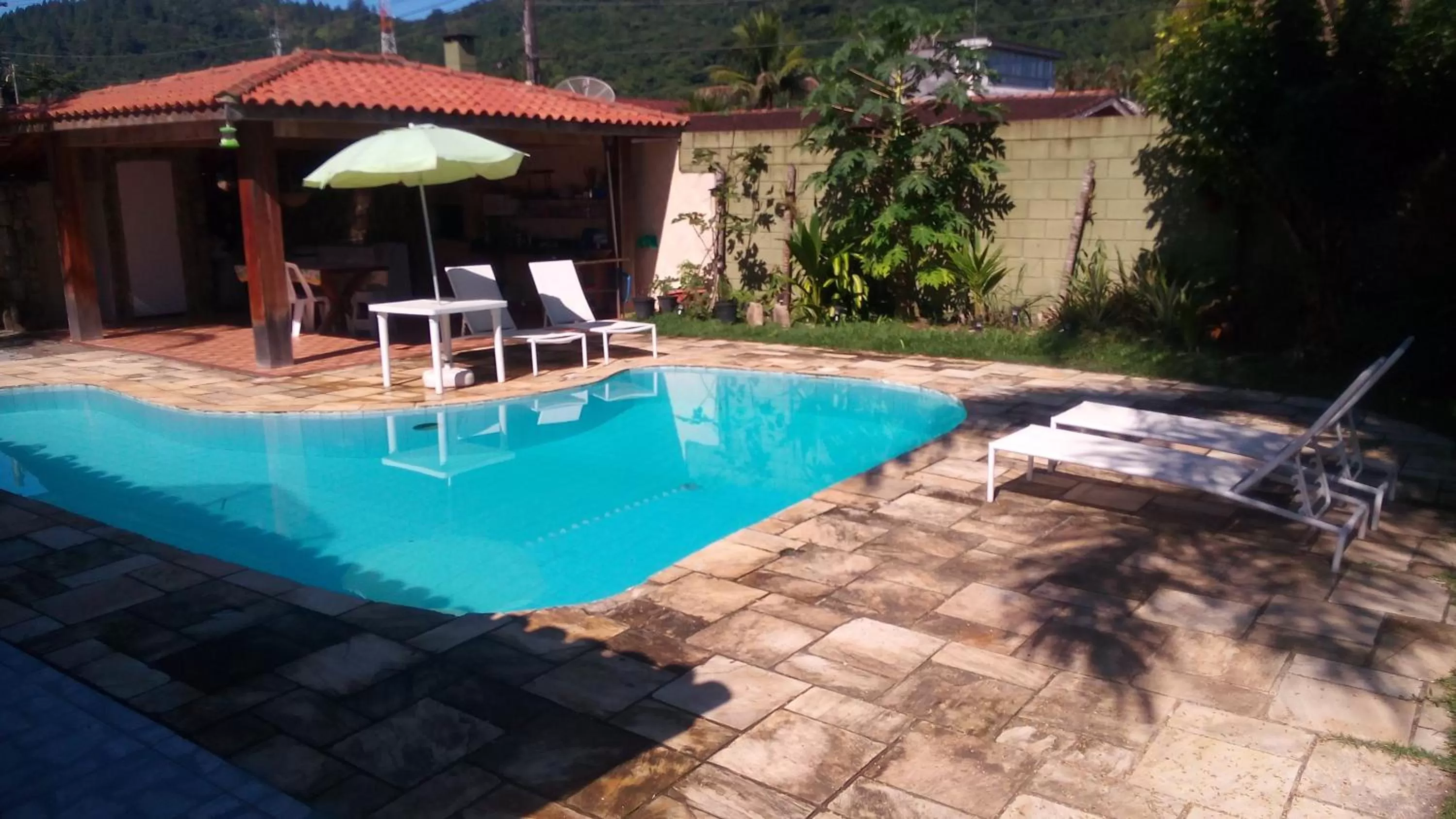 Swimming pool in Pousada Na Praia Ubatuba