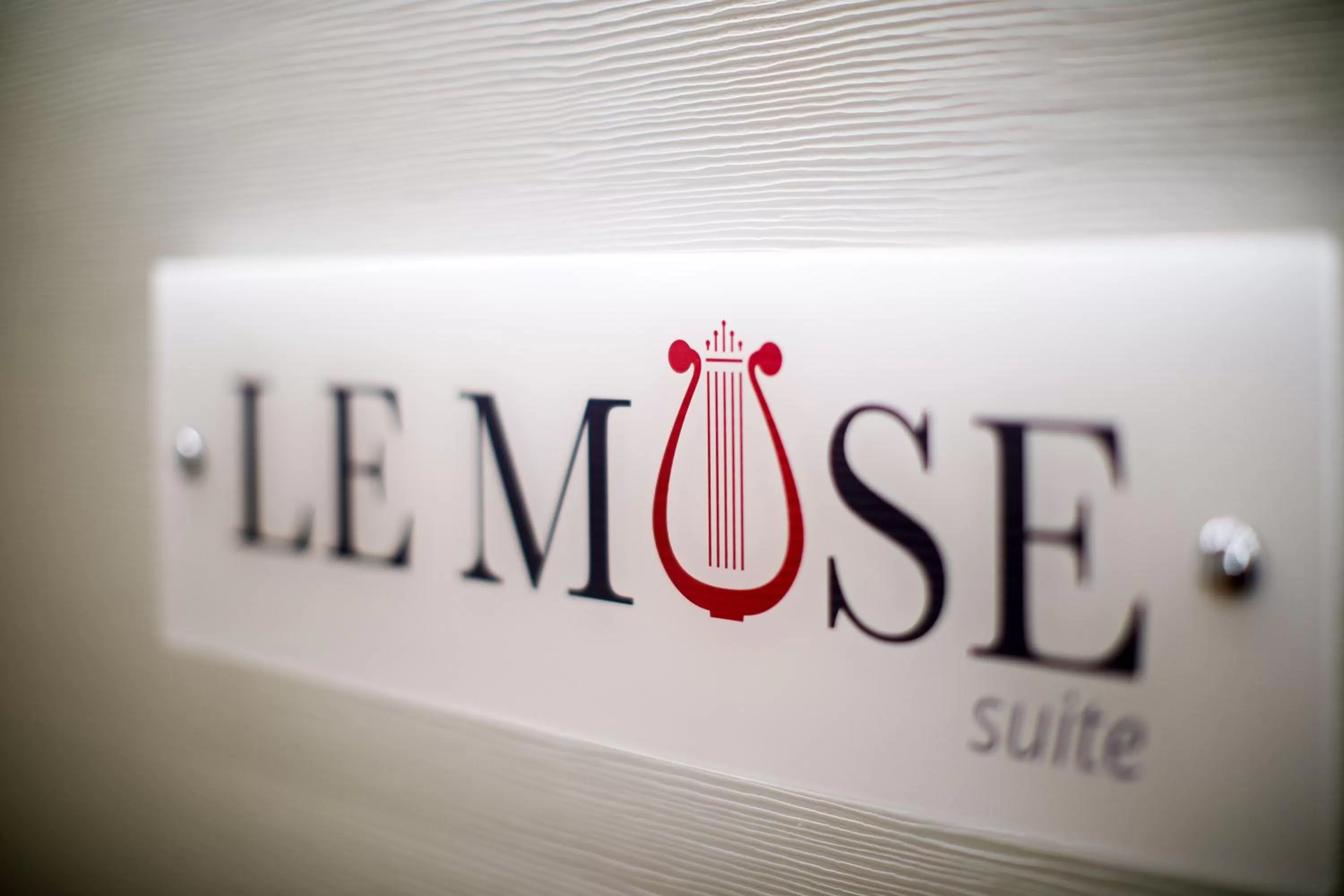 Property logo or sign in Le Muse Suite