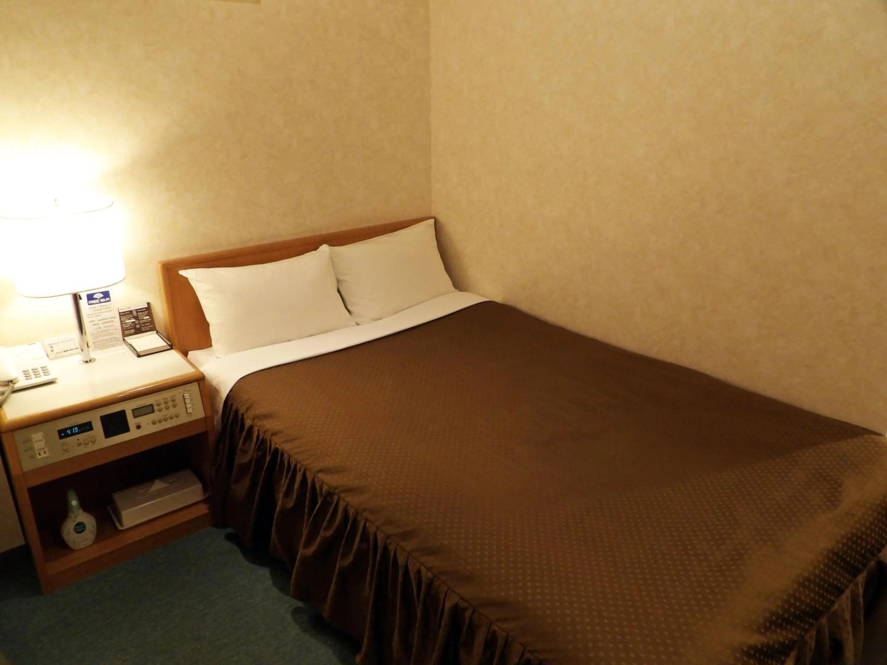 Bed in Southern Cross Inn Matsumoto