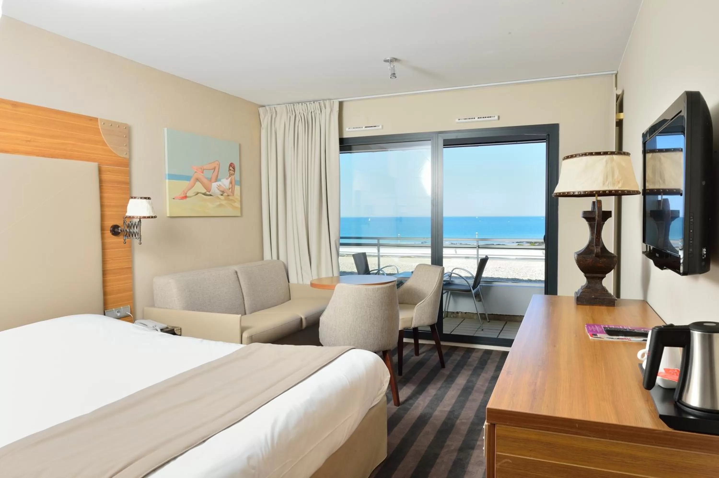 Photo of the whole room, Bed in Côte Ouest Thalasso & Spa Les Sables d'Olonne - MGallery Collection