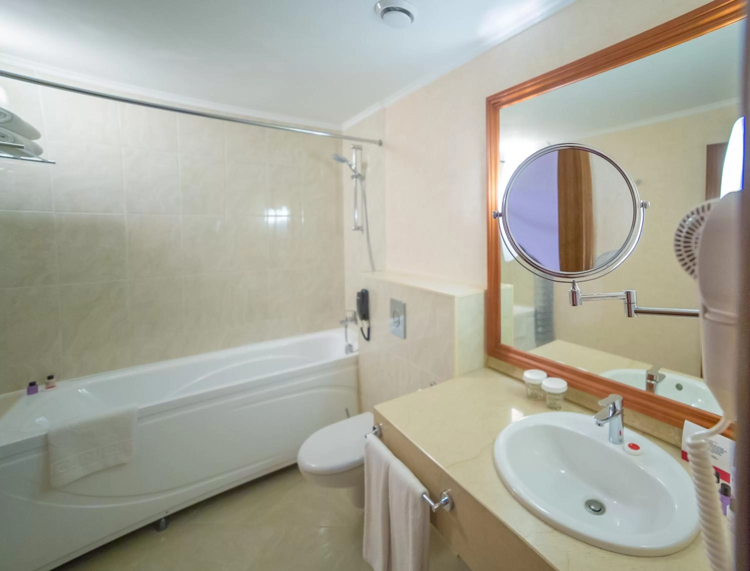 Bathroom in Ramada by Wyndham Almaty