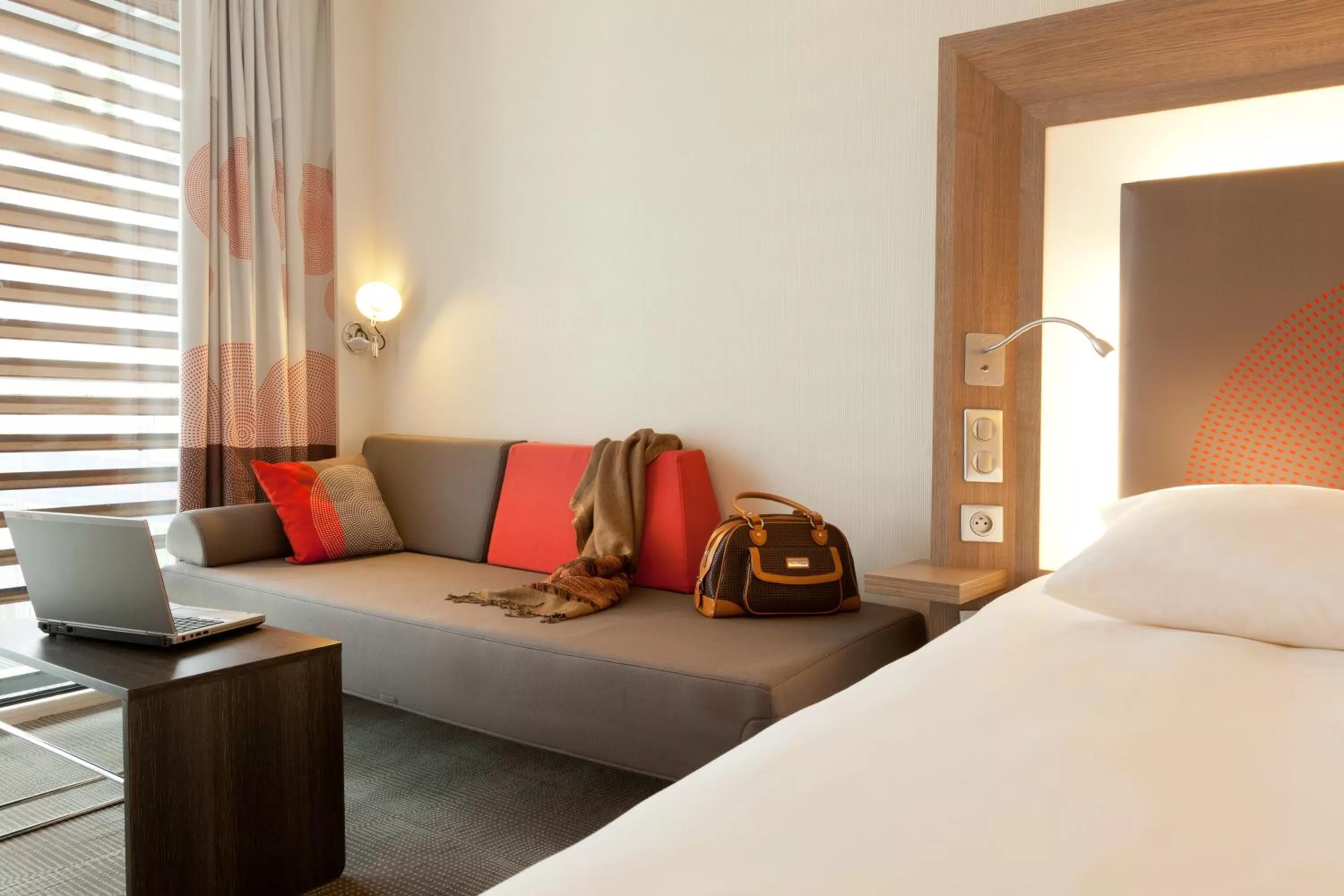 Seating area, Bed in Novotel Paris 17