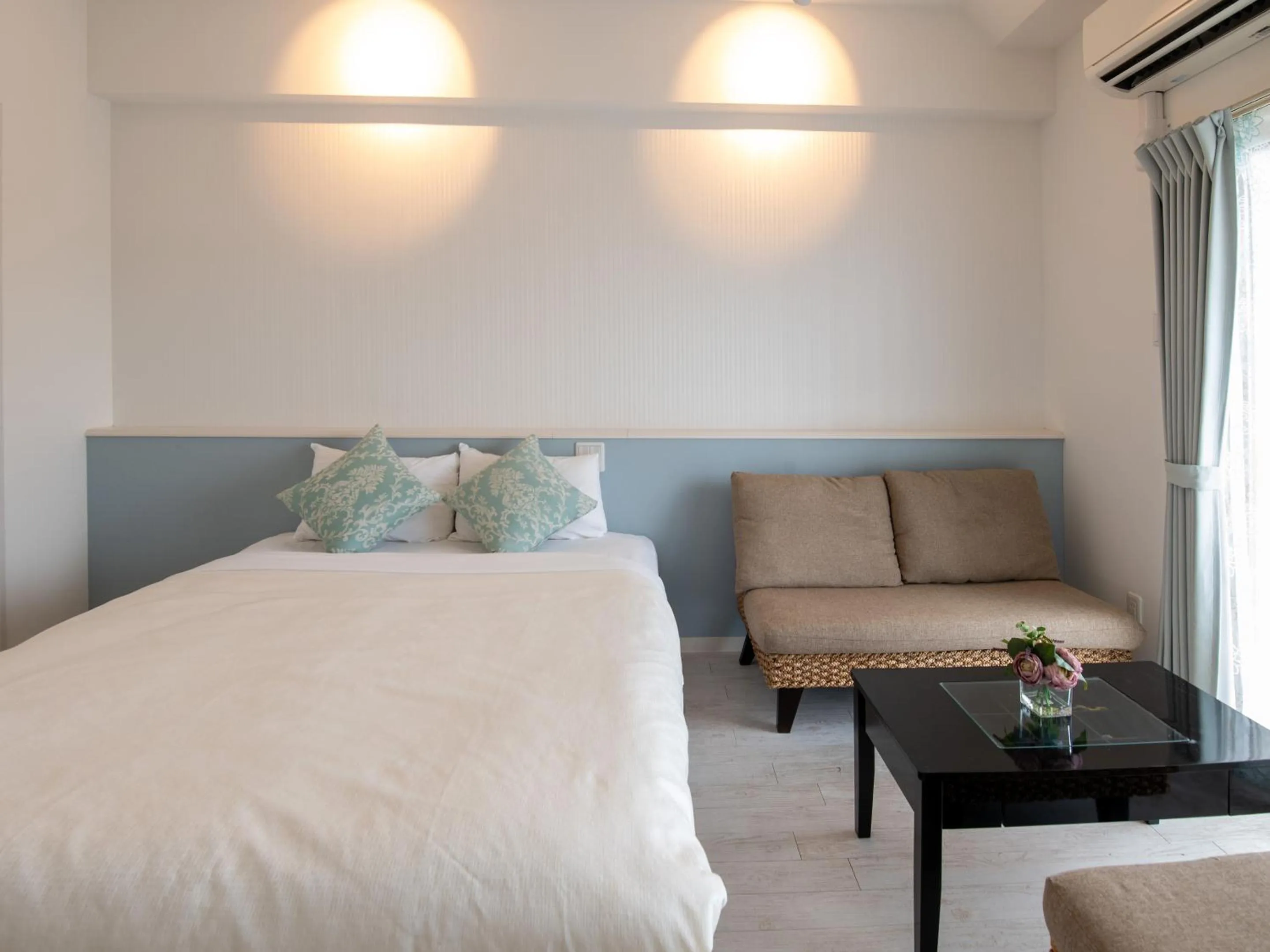 Bed in Cozy Stay in Naha