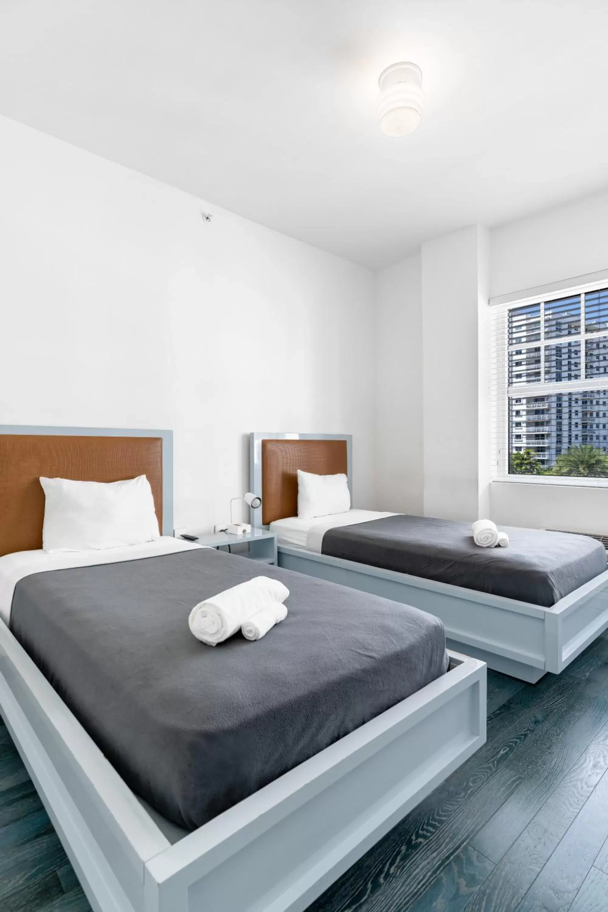 Room with One Queen Bed and Two Twin Beds, Non-Smoking in The Variety by LuxUrban Room with One Queen Bed and Two Twin Beds, Non-Smoking in The Variety by LuxUrban