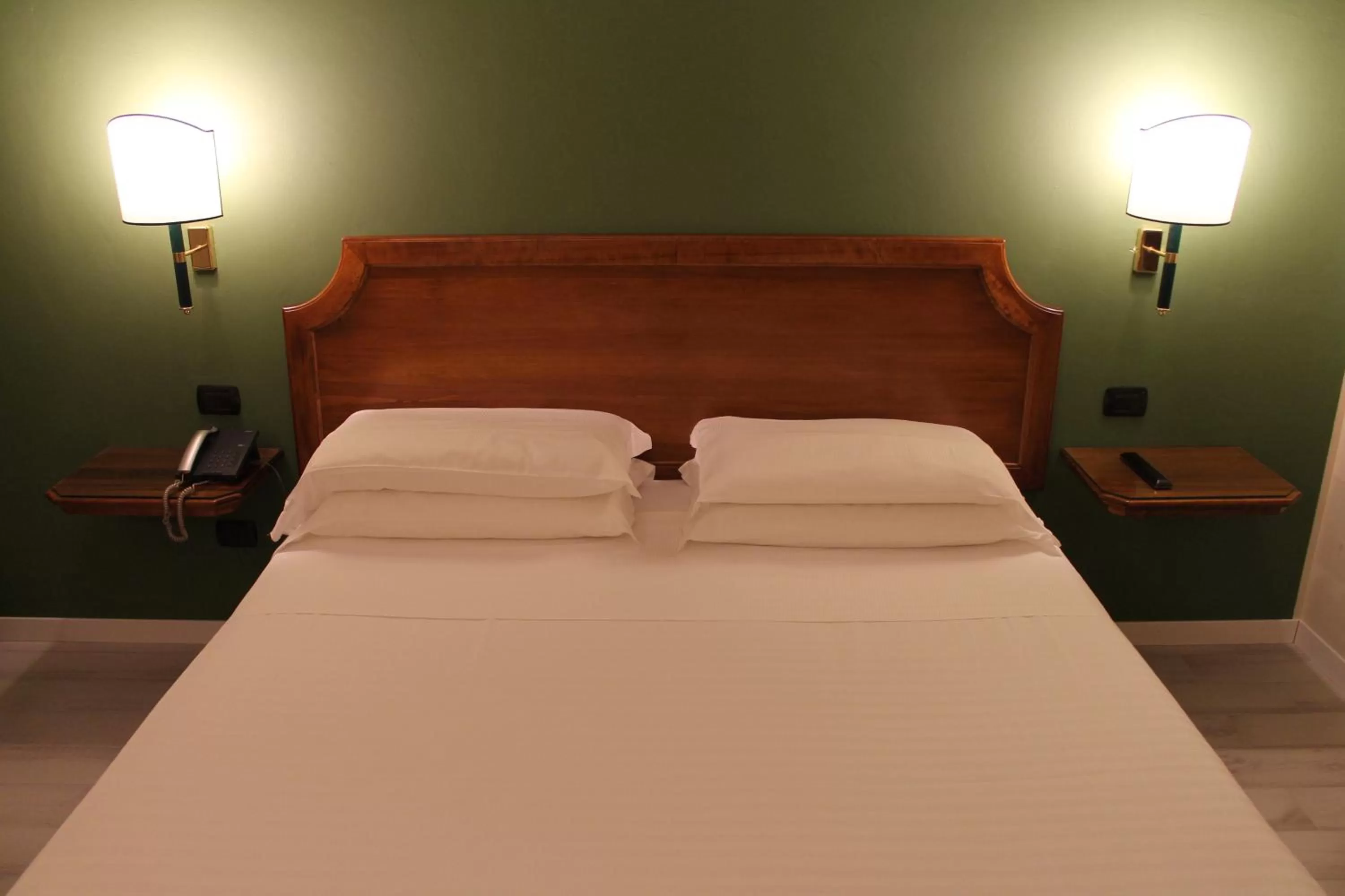 Bed in Hotel Don Carlo