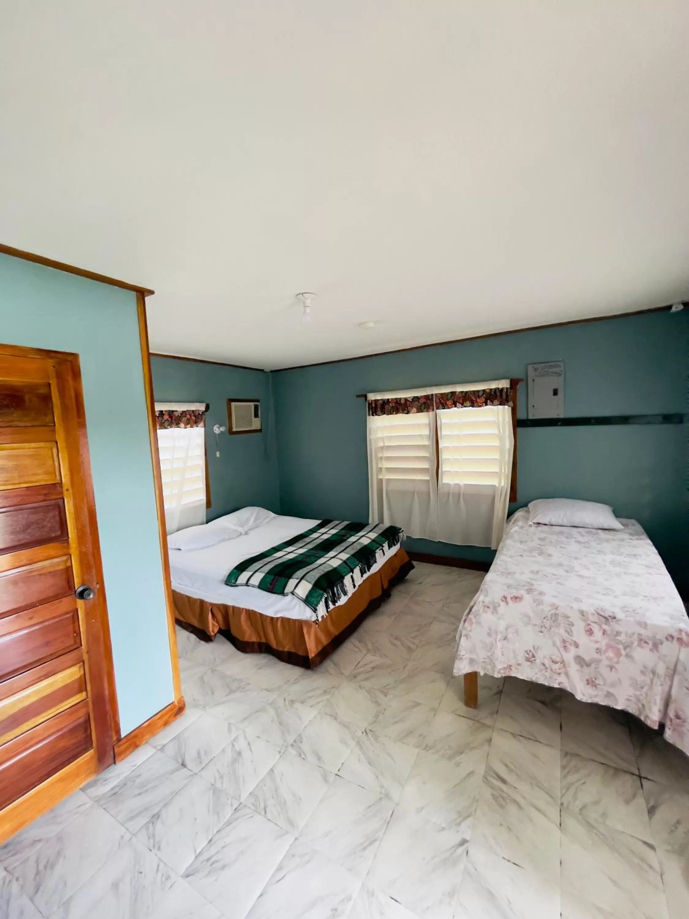 Bed in Lamanai Riverside Retreat