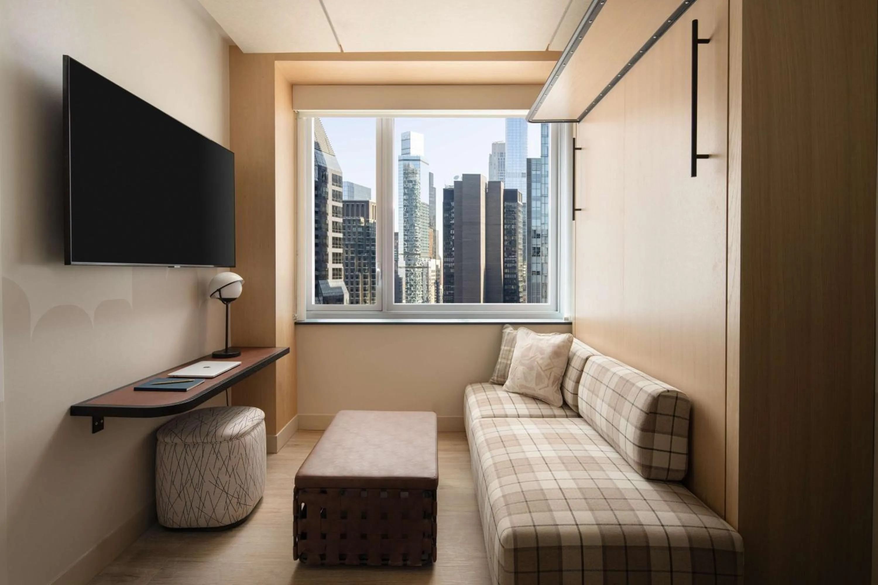 Living room, Bed in Motto By Hilton New York City Times Square