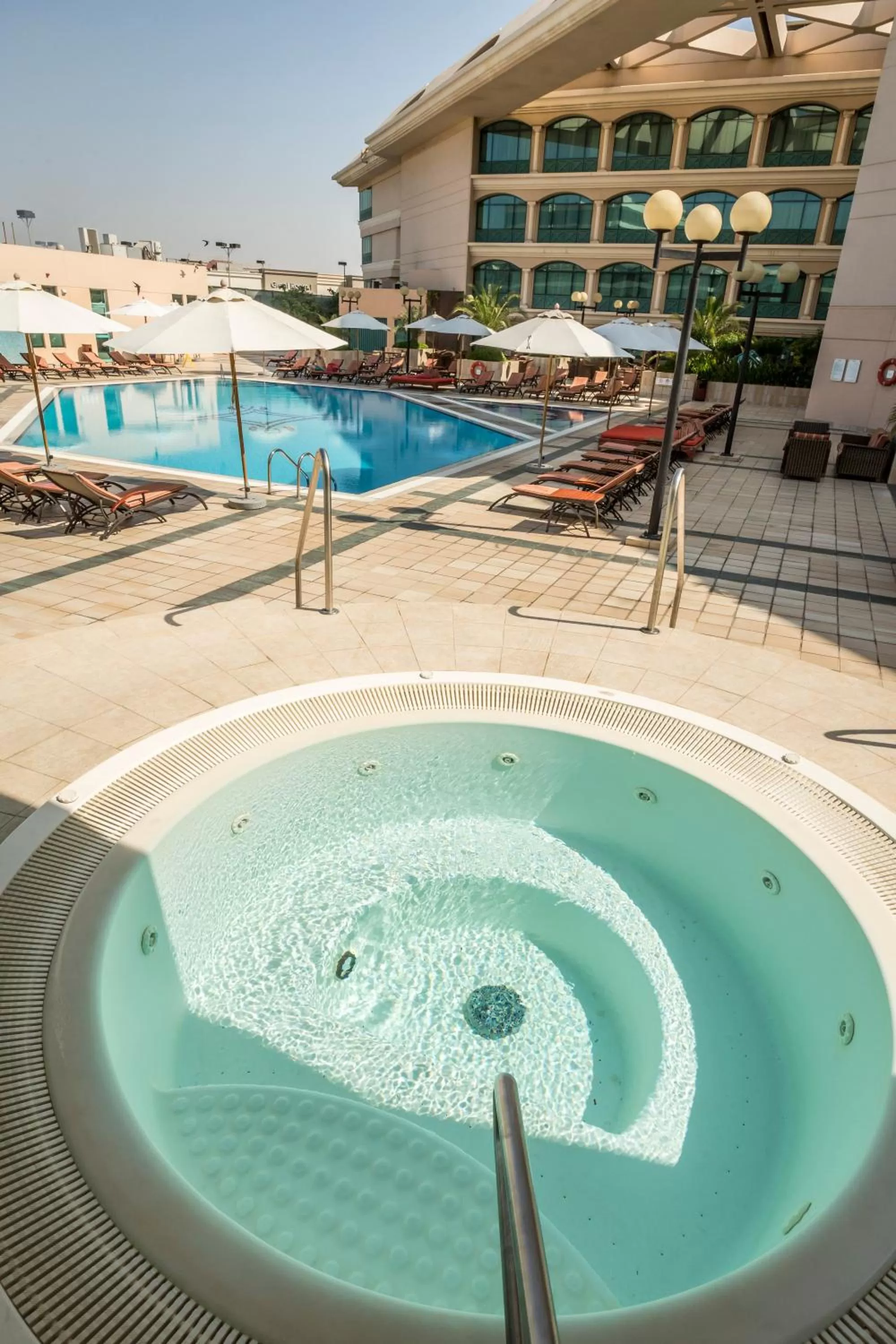 Swimming pool in Mövenpick Grand Al Bustan