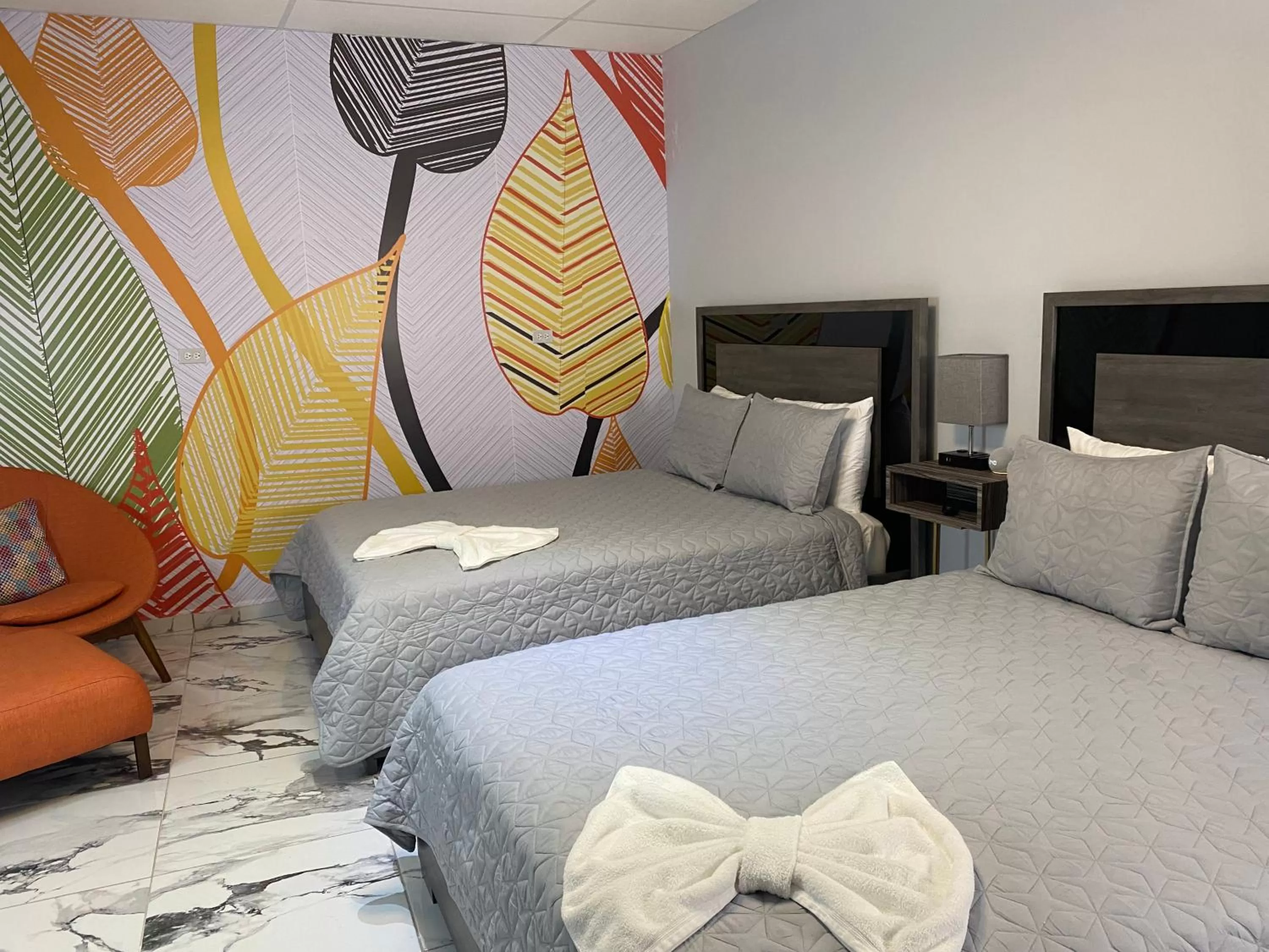 Bed in Itza-Bella Suites