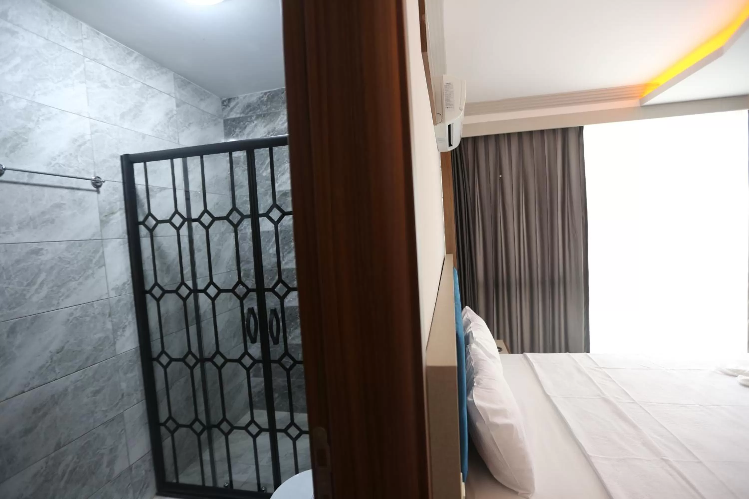 Bed in TEVETOGLU HOTEL