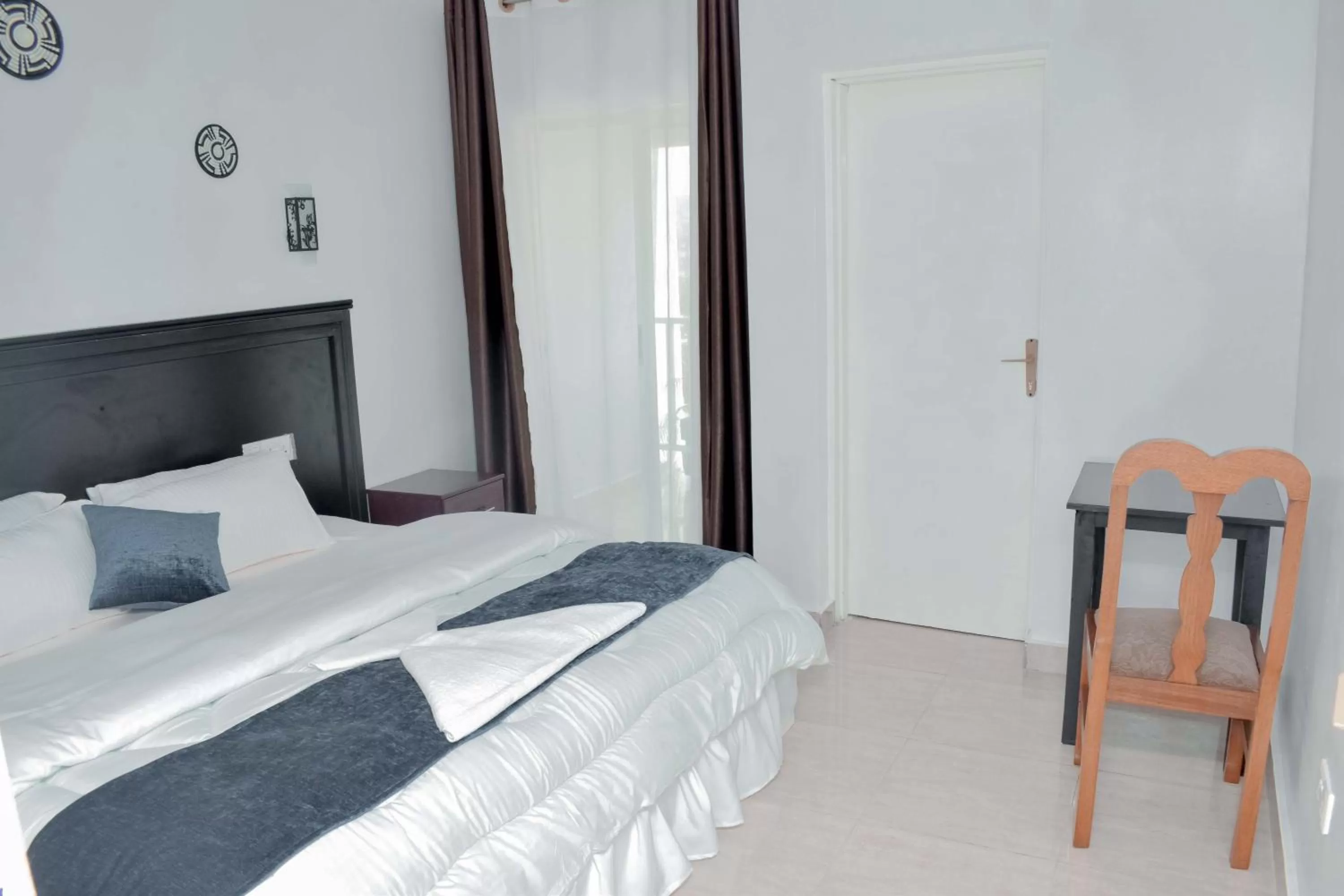 Bed in INZOZI AFRICA HOUSE B&B-Gishushu