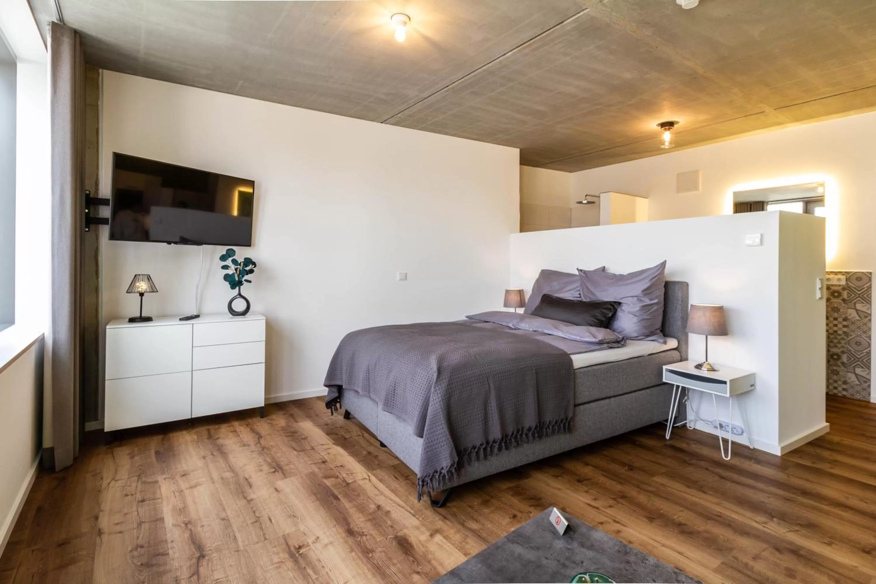 Bed in Gohlke L.O.F.T. Apartments