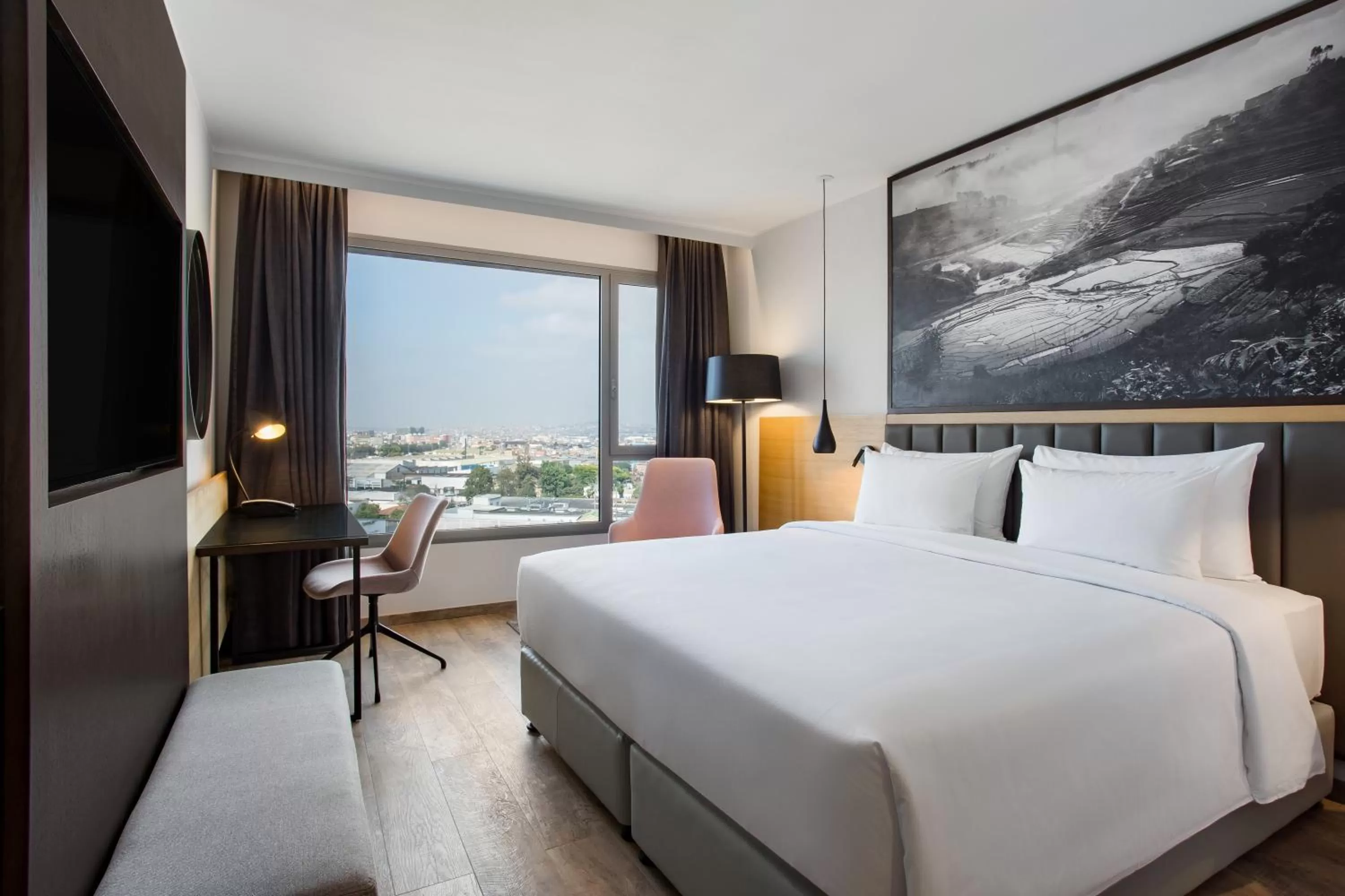 Photo of the whole room, Bed in Radisson Blu Hotel Antananarivo Waterfront