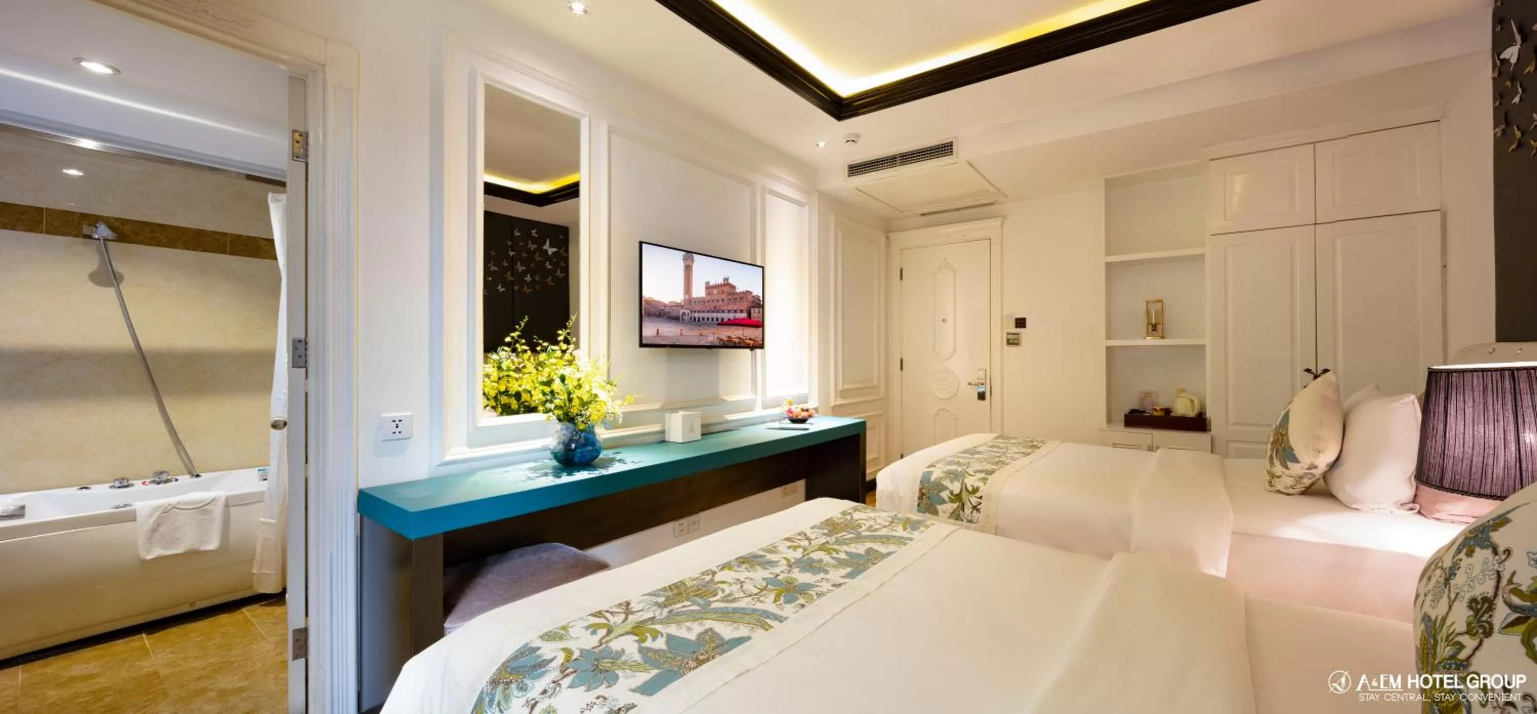 Bed in A&EM Saigon Hotel