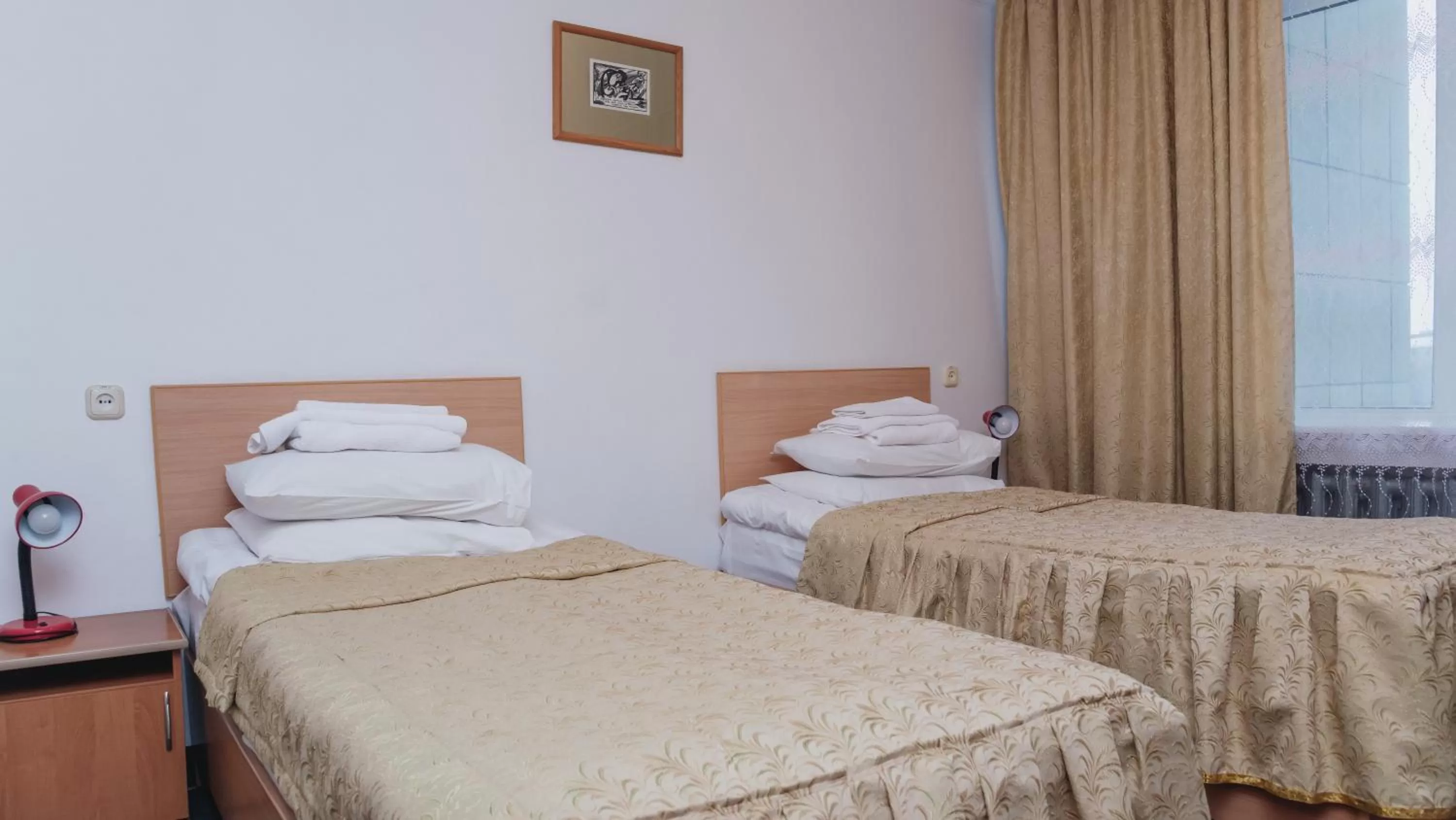 Bed in Aktobe Hotel