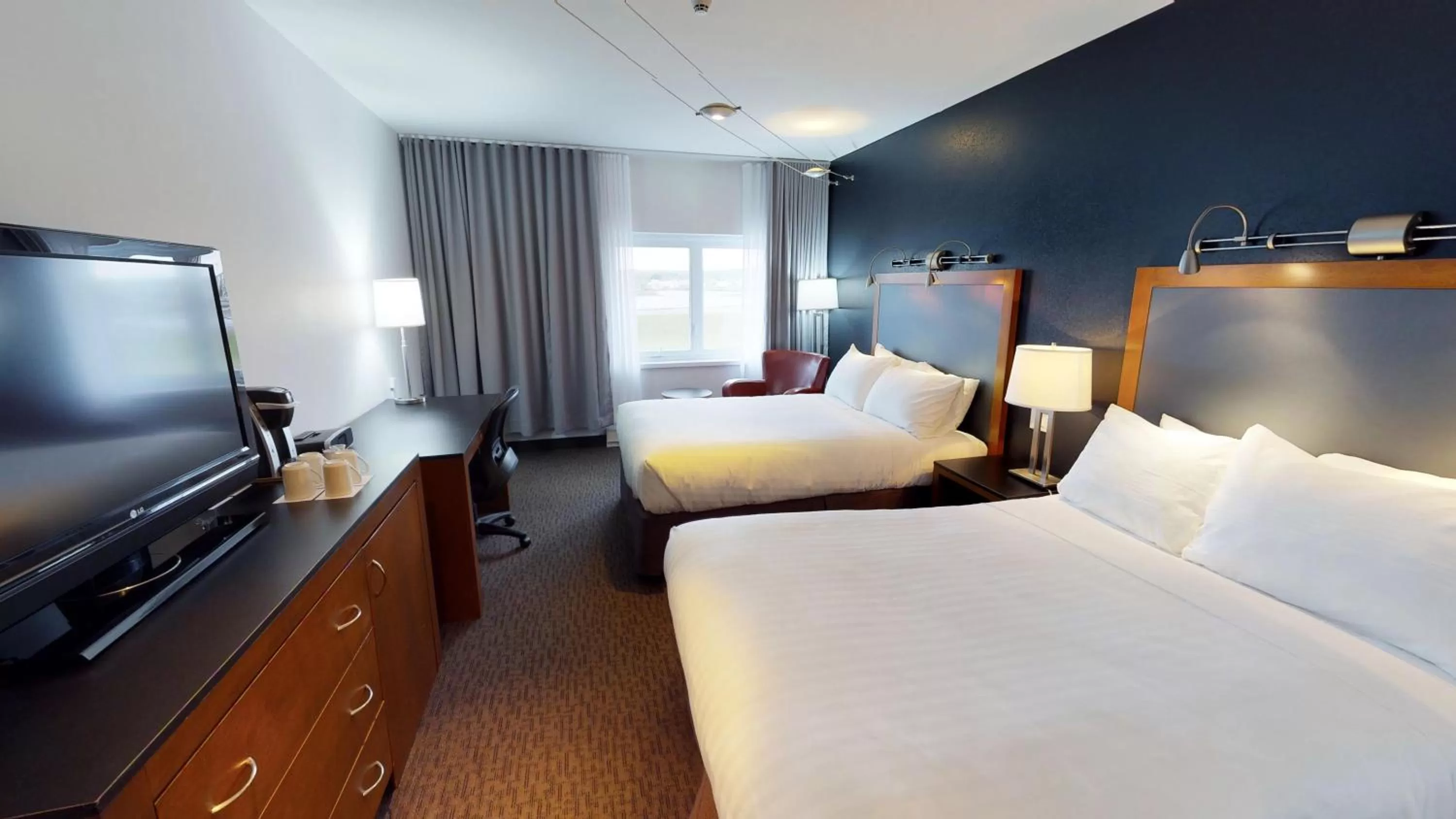 Photo of the whole room, Bed in Riotel Matane