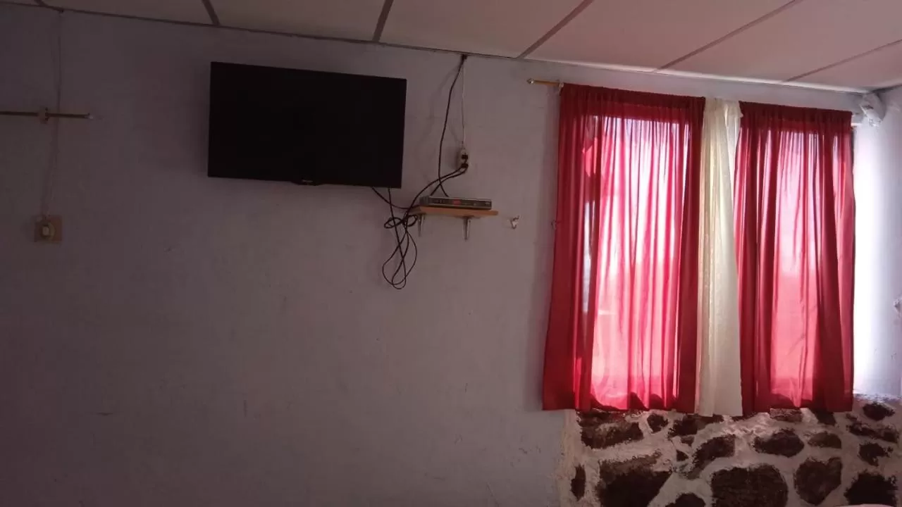 TV/Entertainment Center in Hostal Cabañas Don Jorge