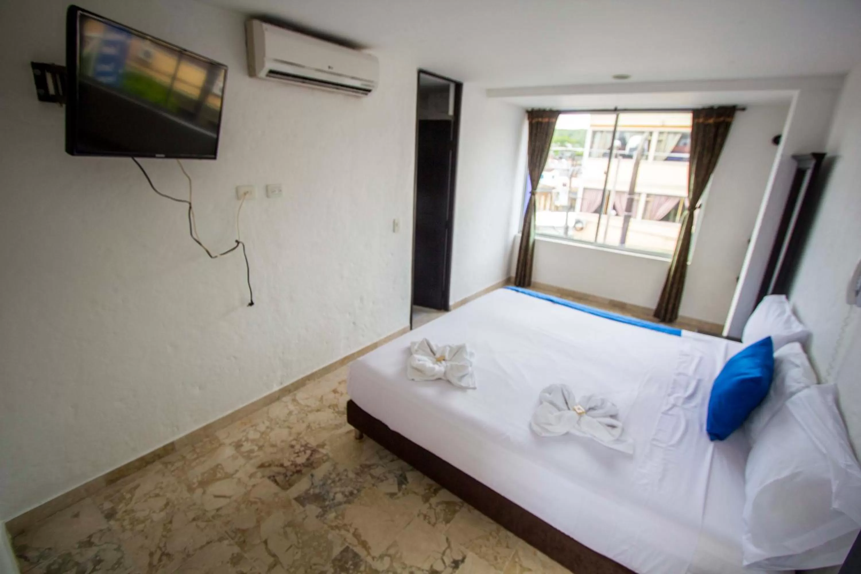 Bed in Blue Star Hotel