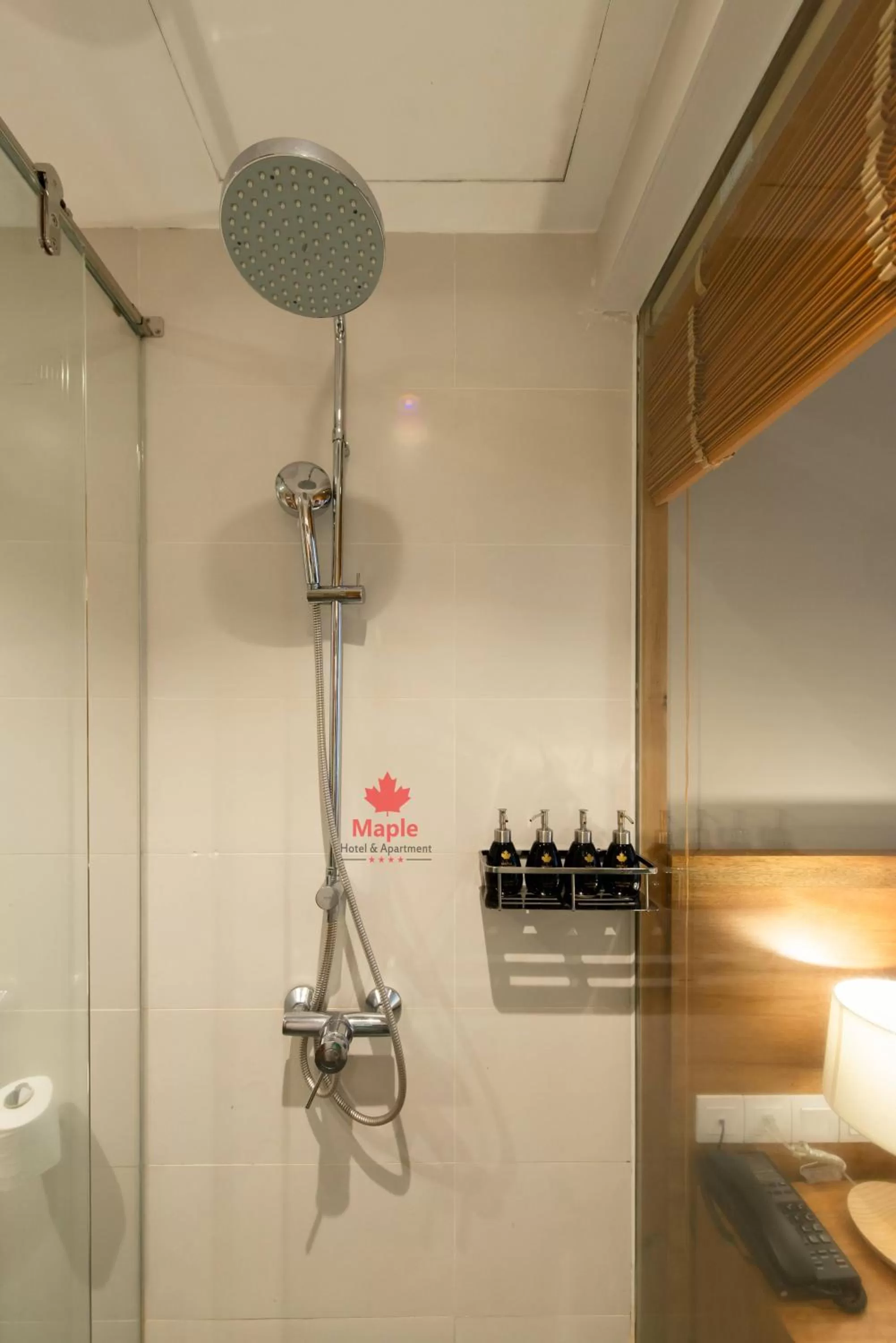 Shower in Maple Hotel & Apartment