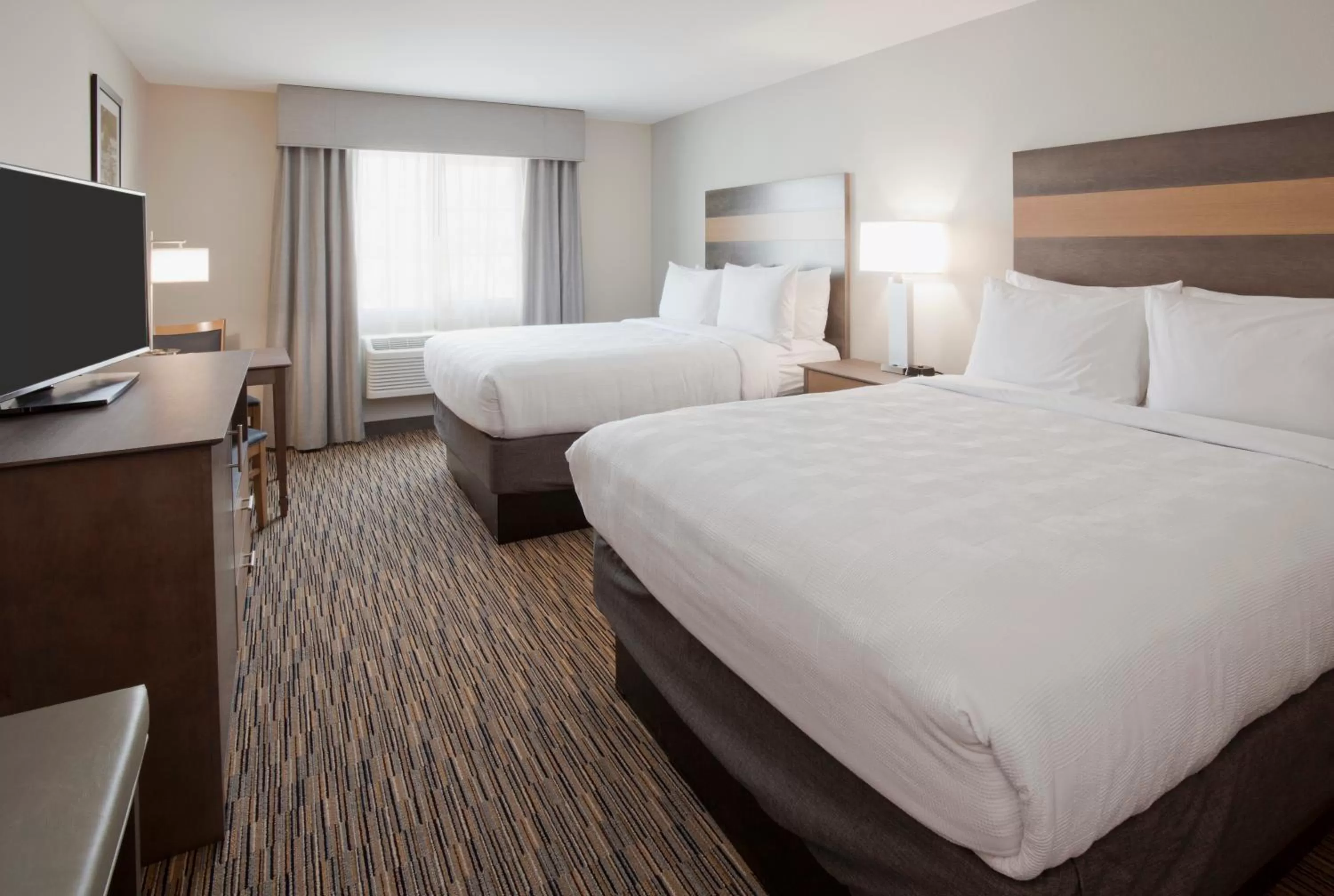 Photo of the whole room, Bed in GrandStay Hotel & Suites