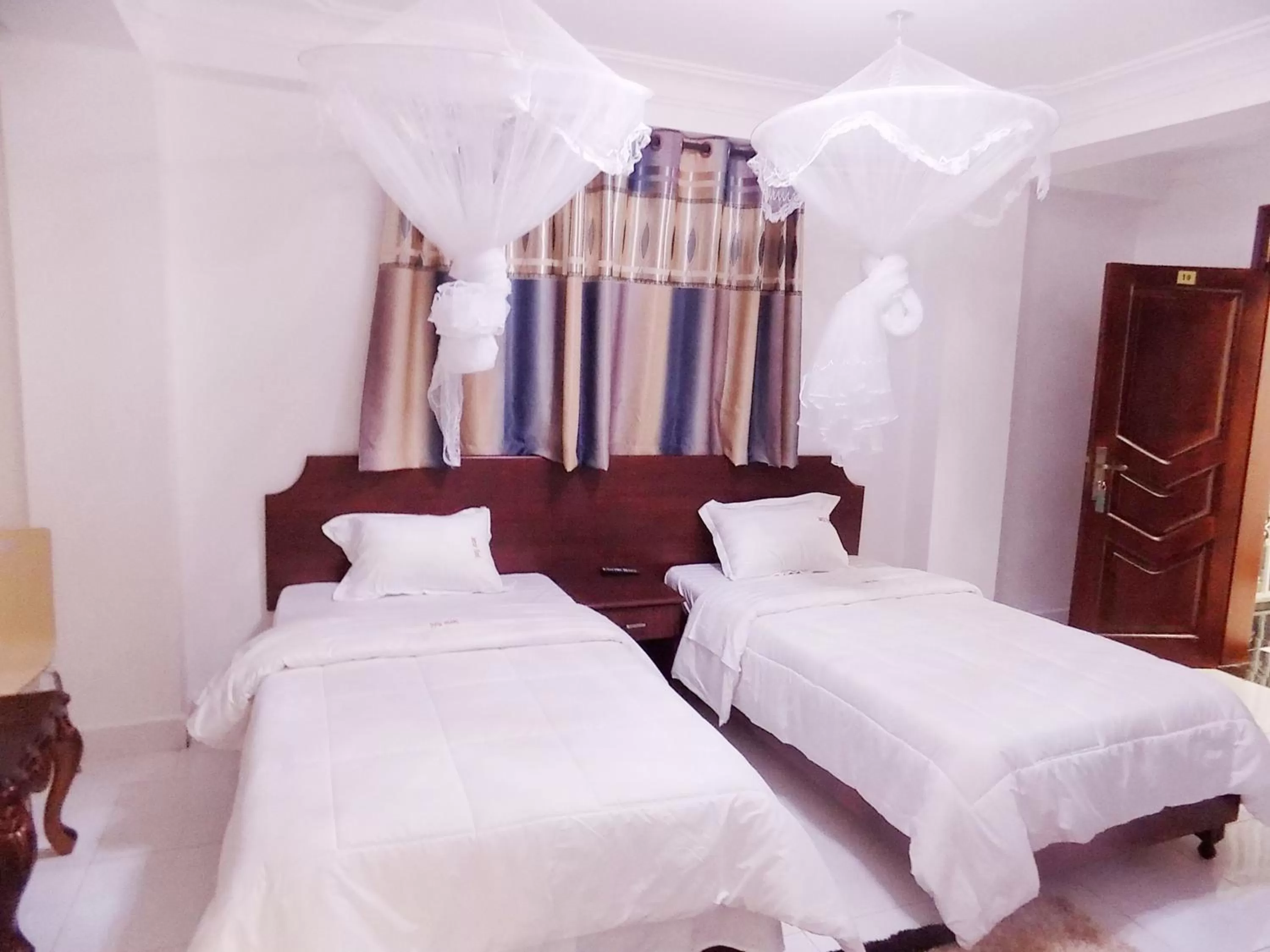 Bed in Sunrise Hotel Kampala