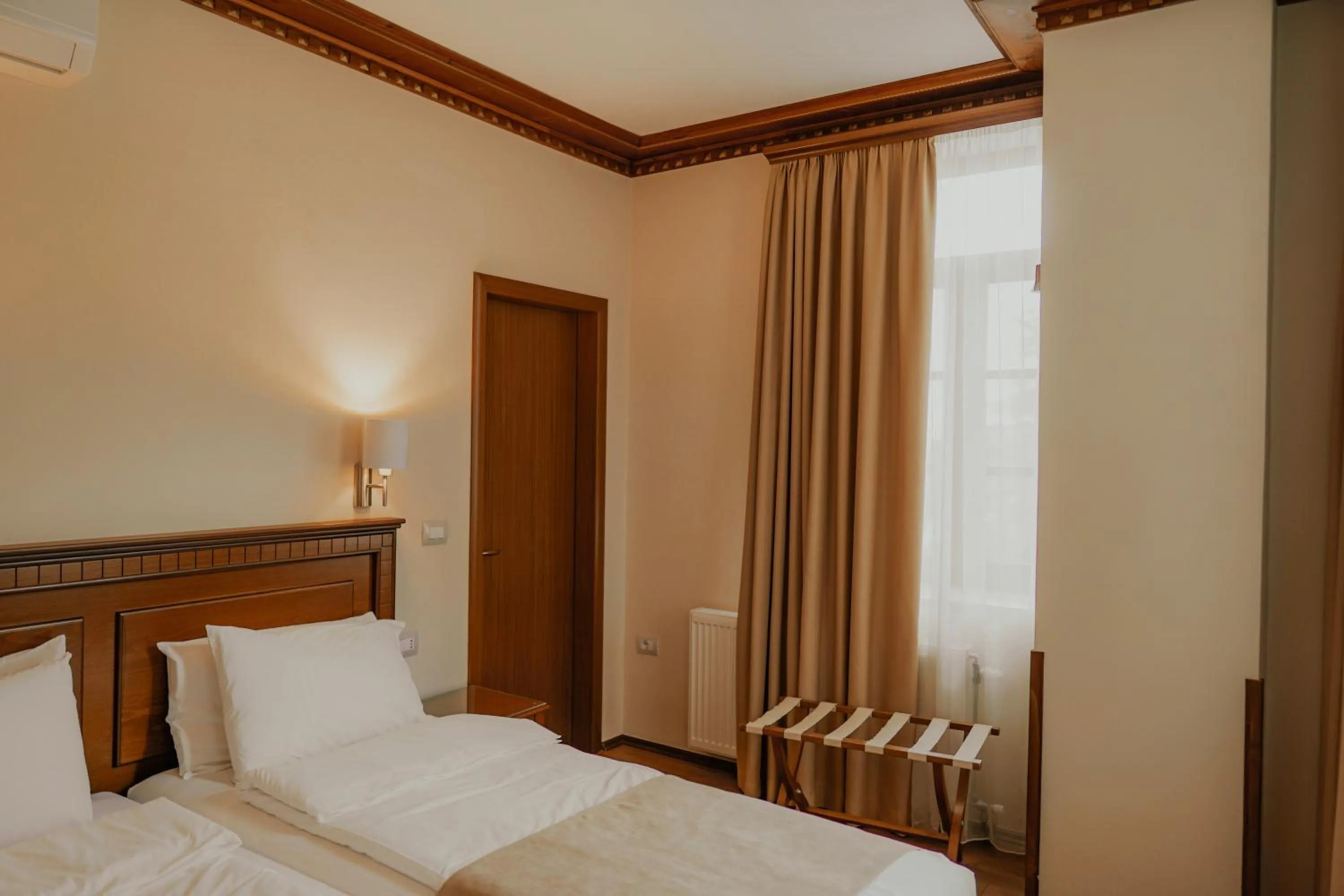 Bed in Hotel Argjiro