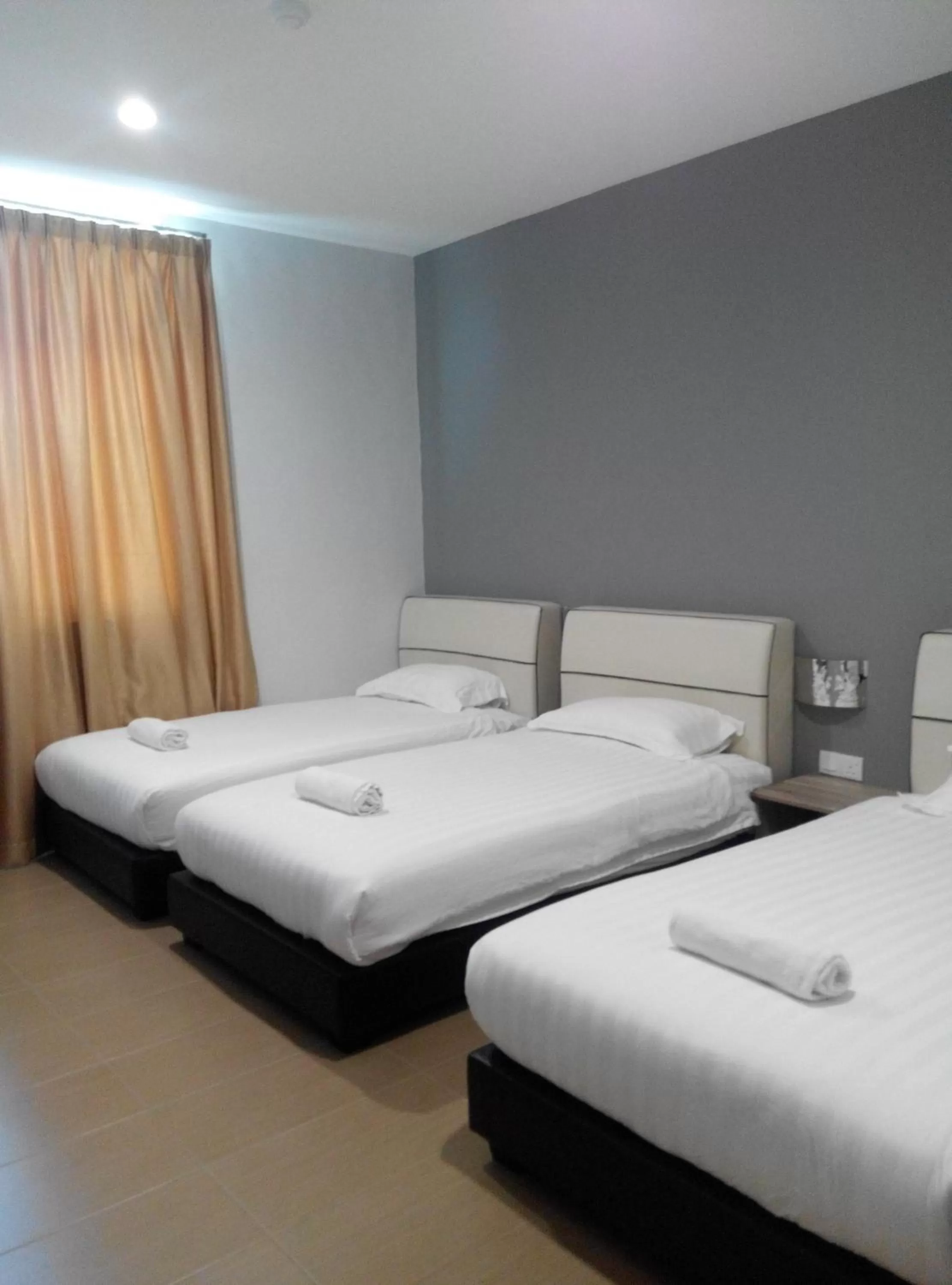 Bed in Welcome Inn GM