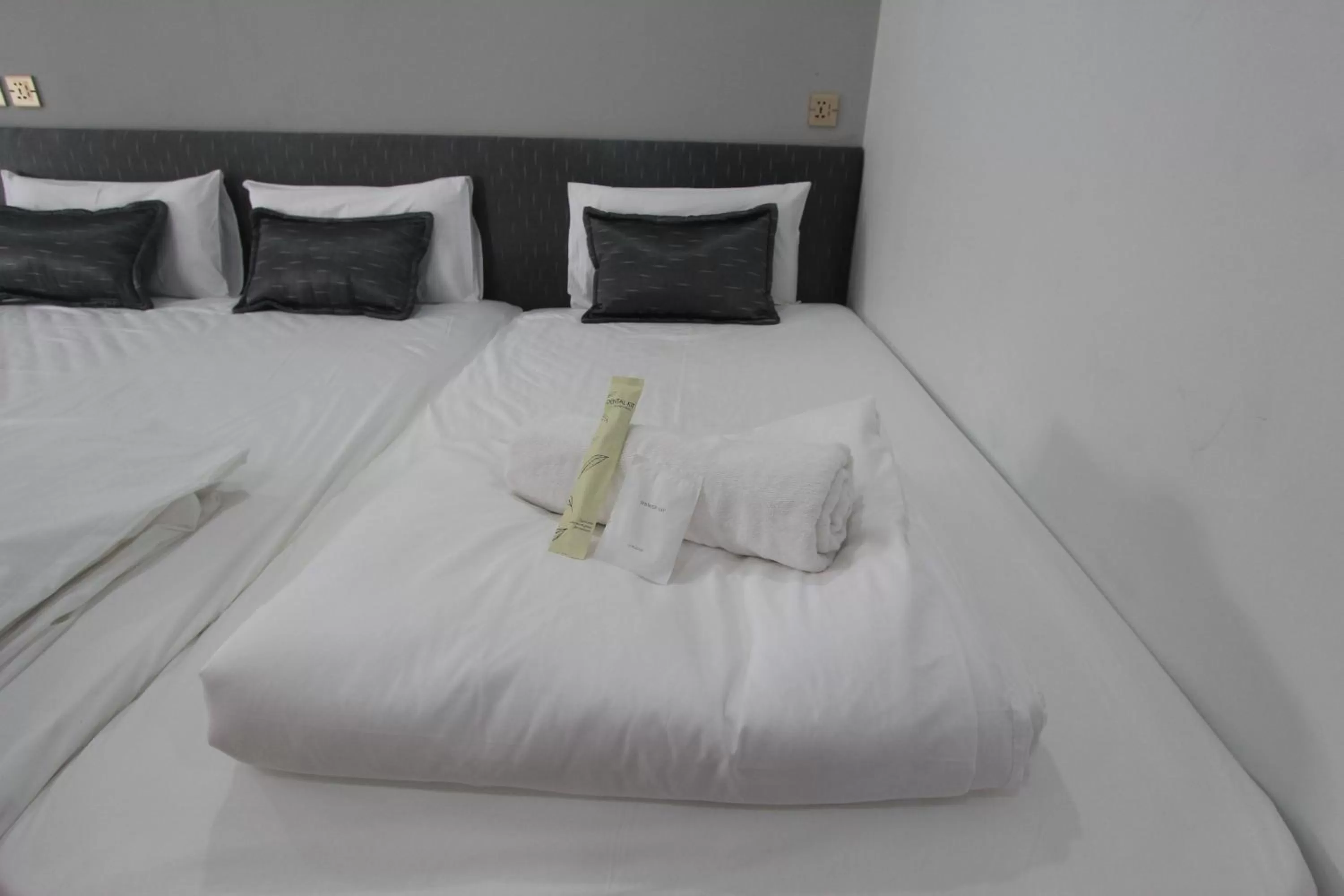 Bed in The Mira Hotel Chiang Rai