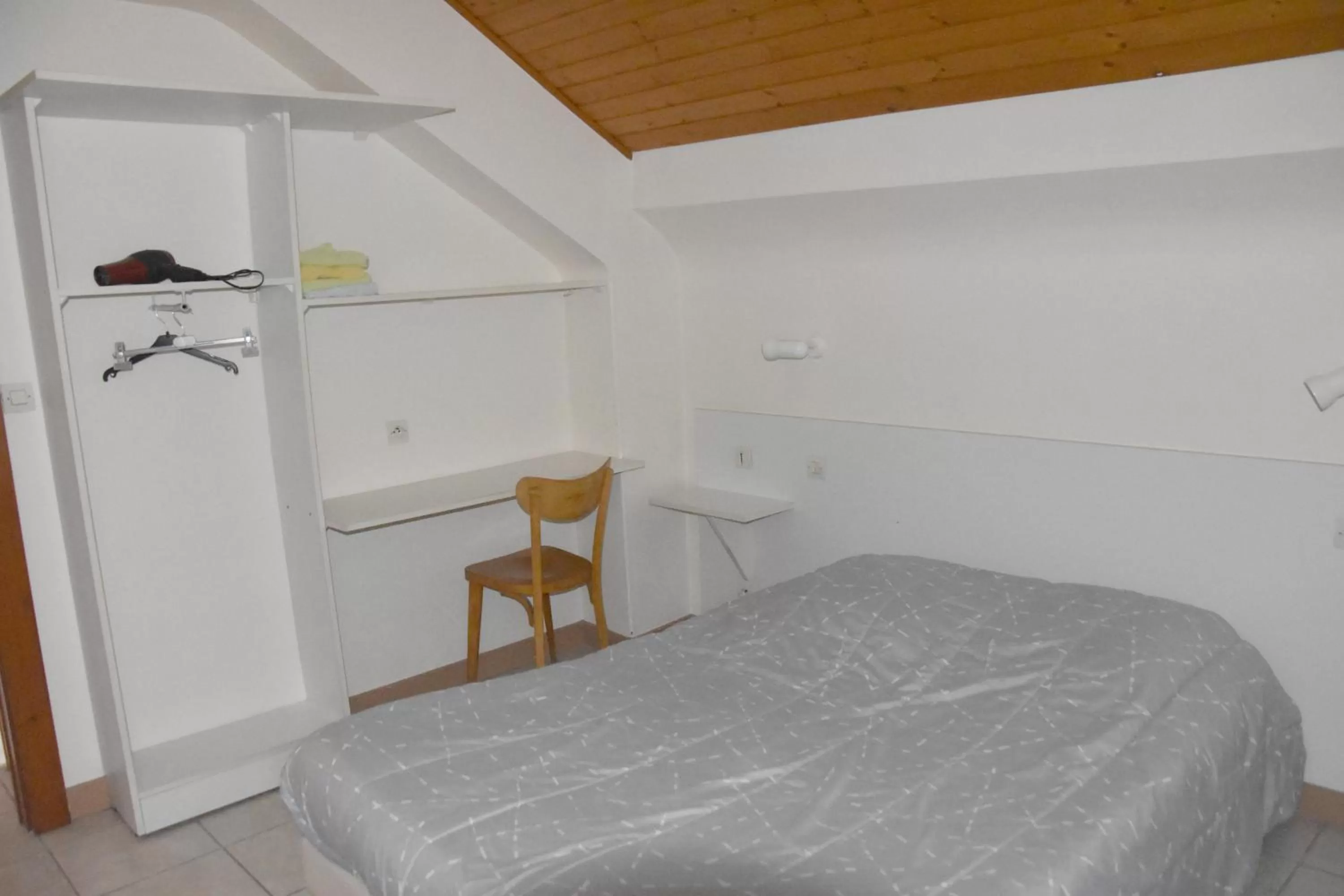 Bed in Hotel Gai Relais