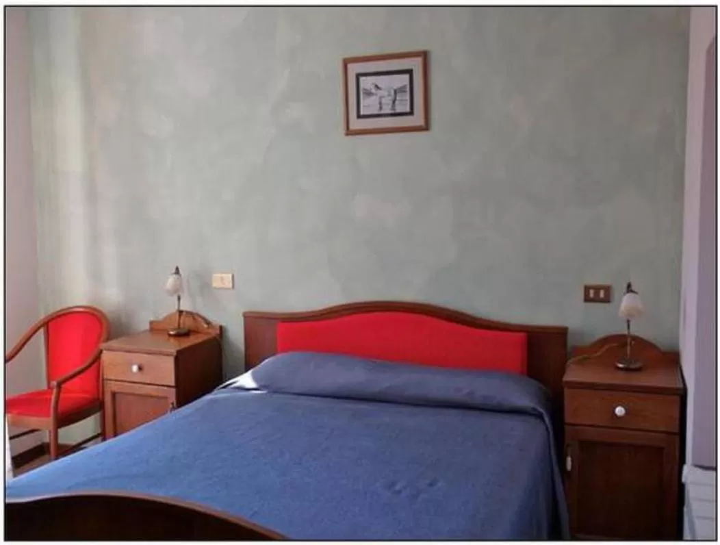 Bed in Albergo Miramonti
