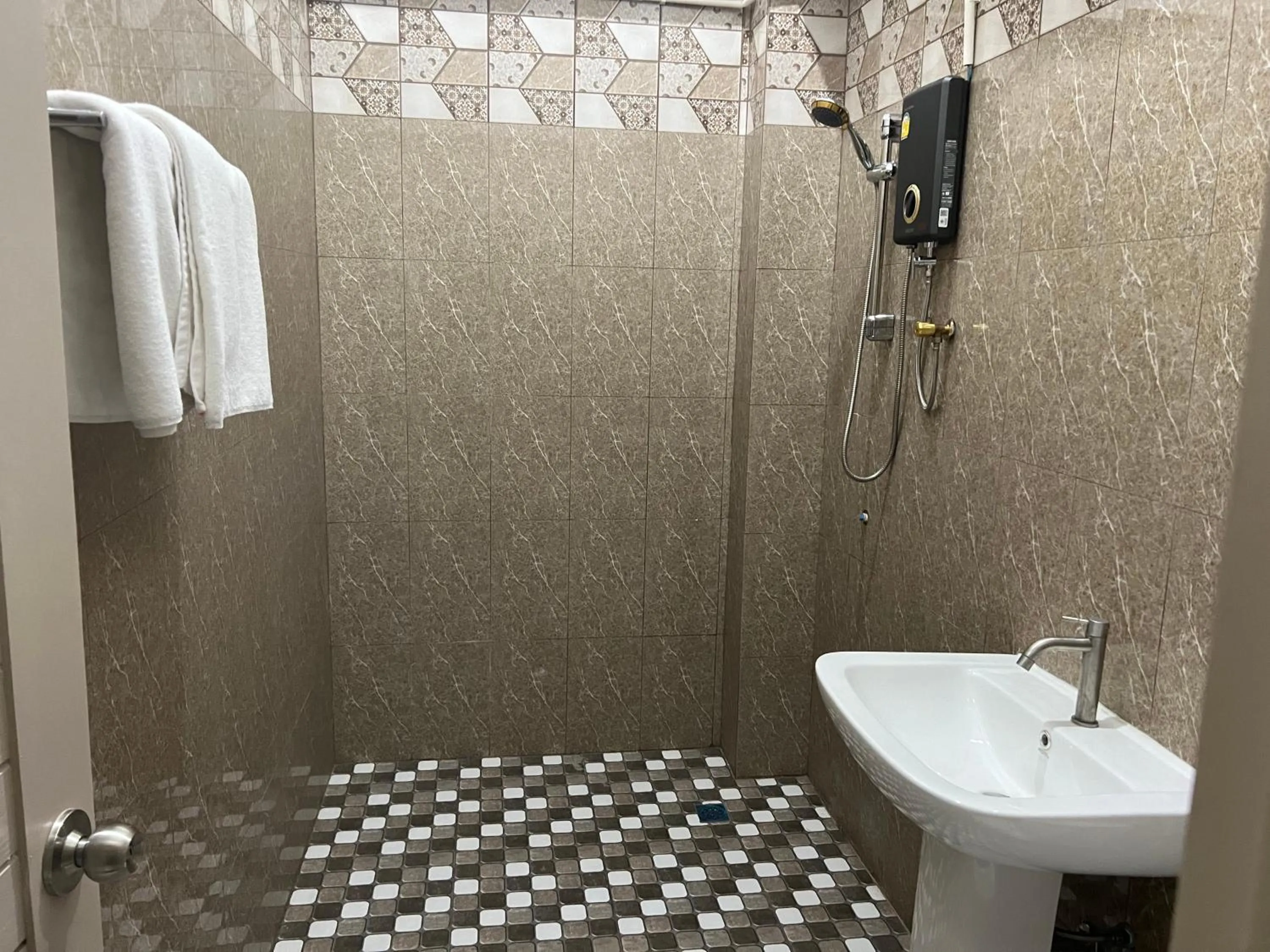 Shower in Mall Suites Hotel