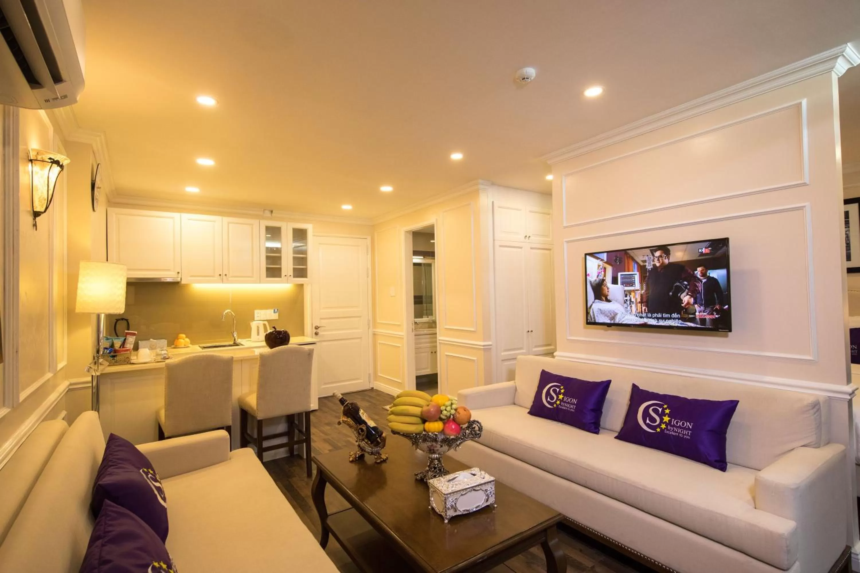 Living room in Saigon By Night Luxury Hotel