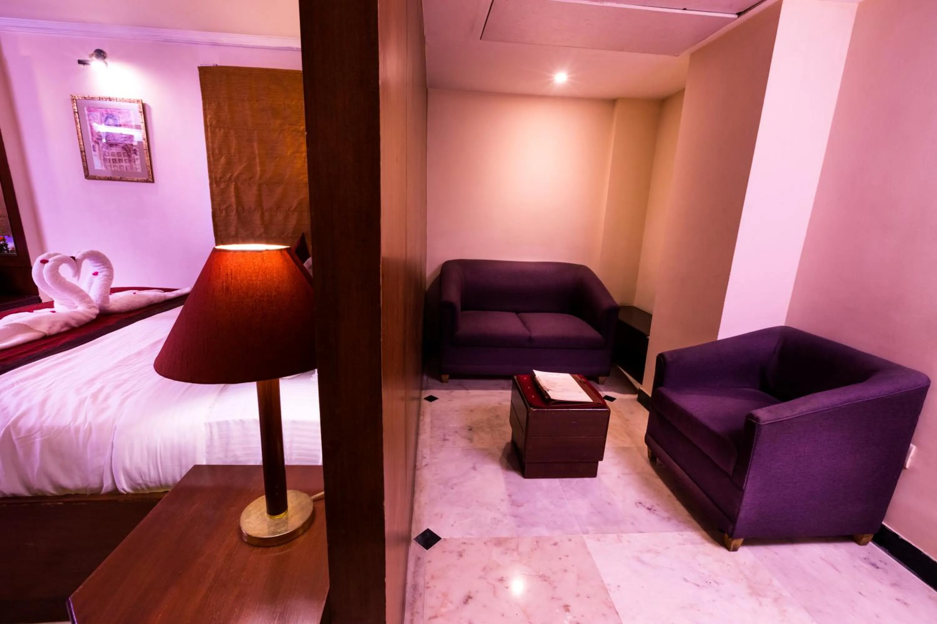 Living room, Bed in Hotel Grand Residence