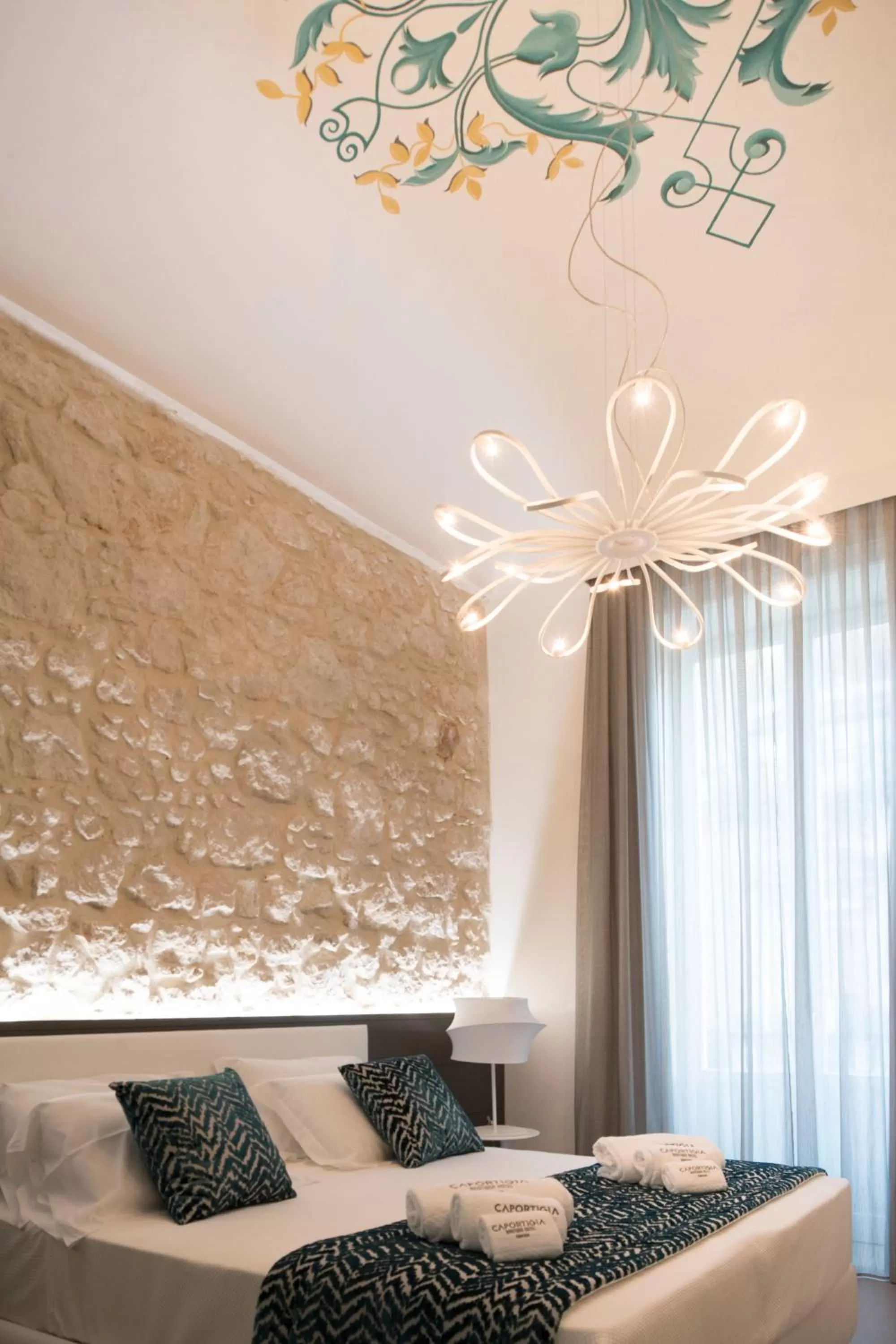 Bed in Caportigia Boutique Hotel
