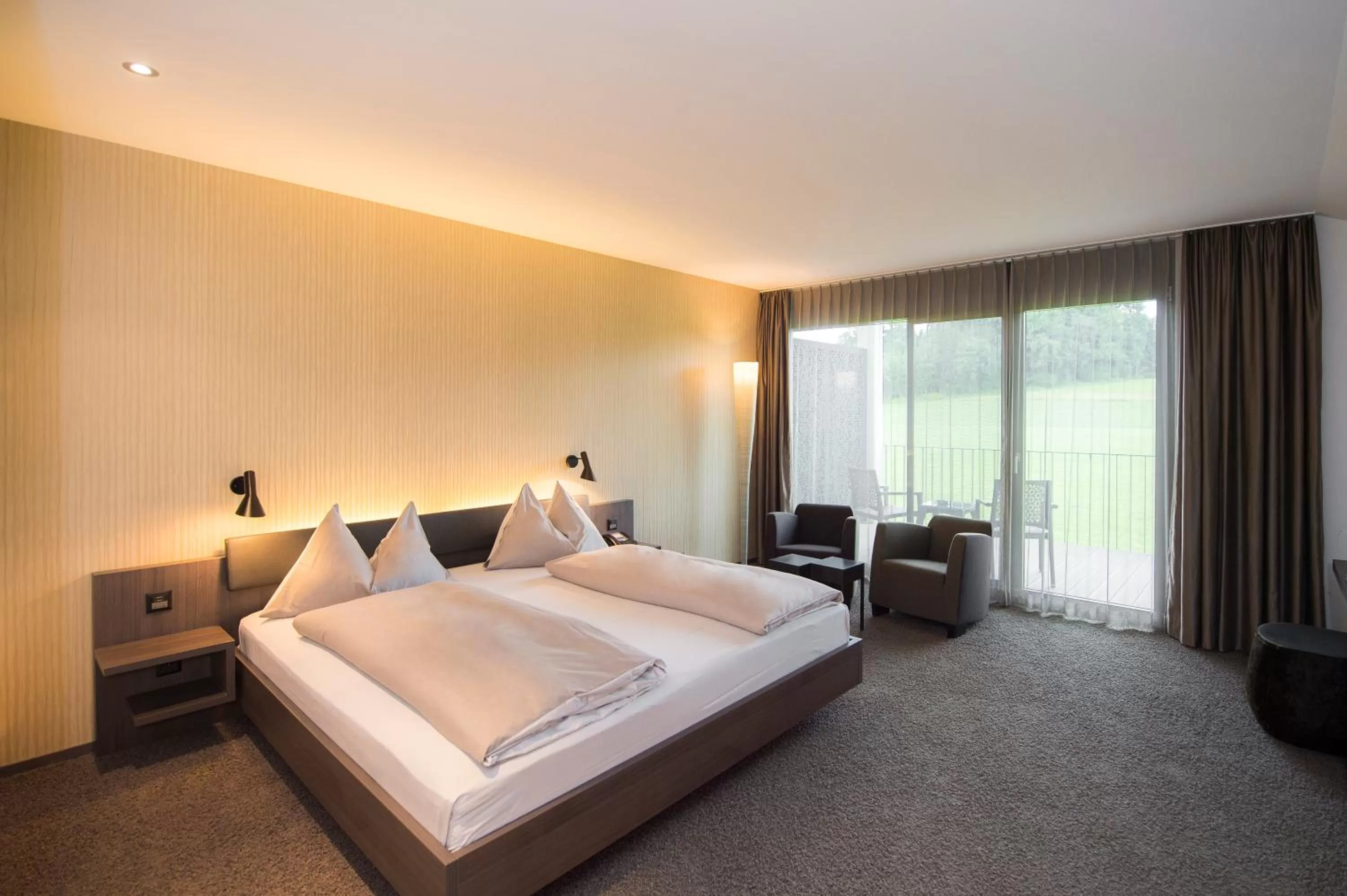 Photo of the whole room, Bed in Wellnesshotel Golfpanorama