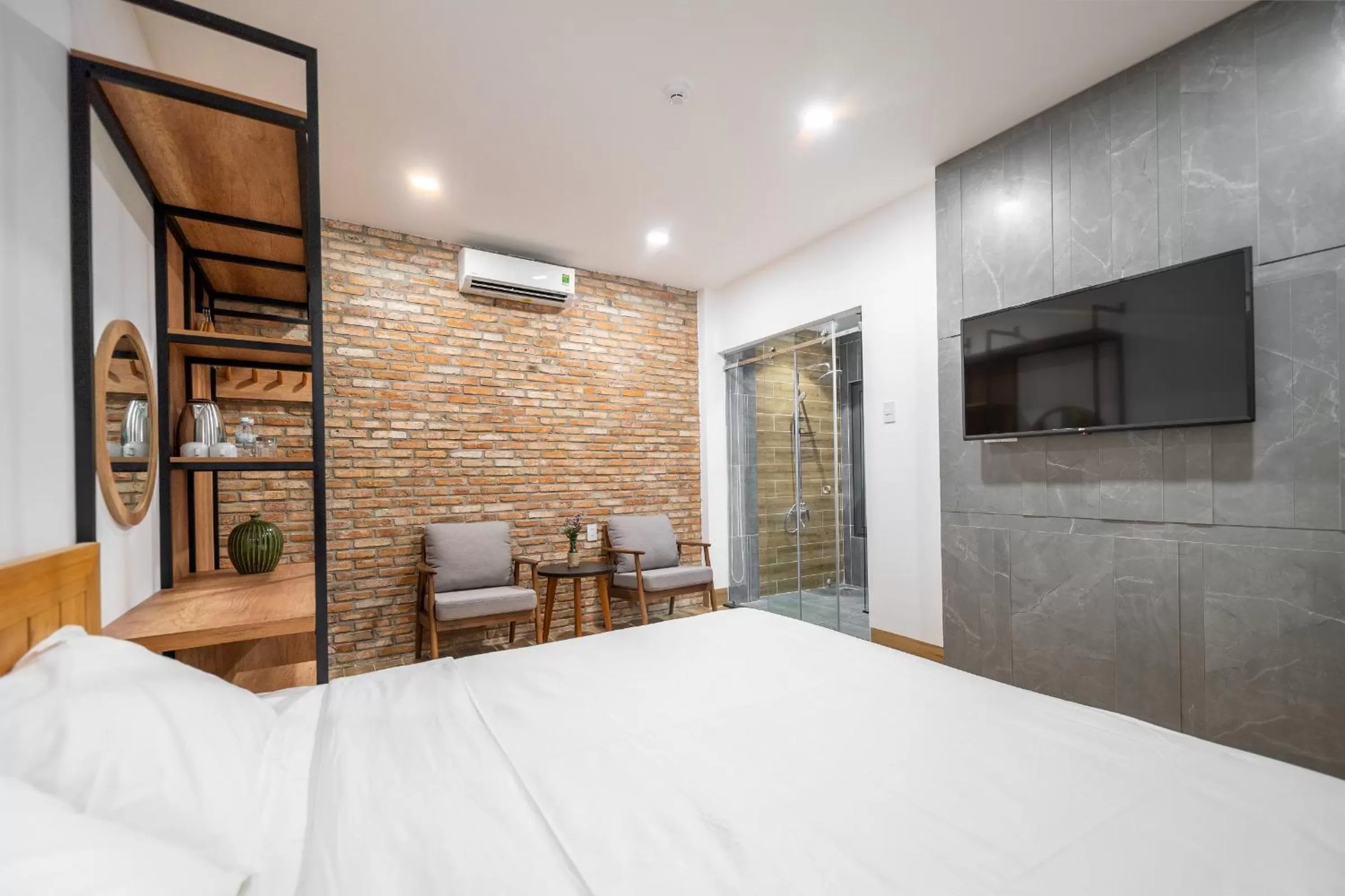 Bed in Coast House Boutique Hotel