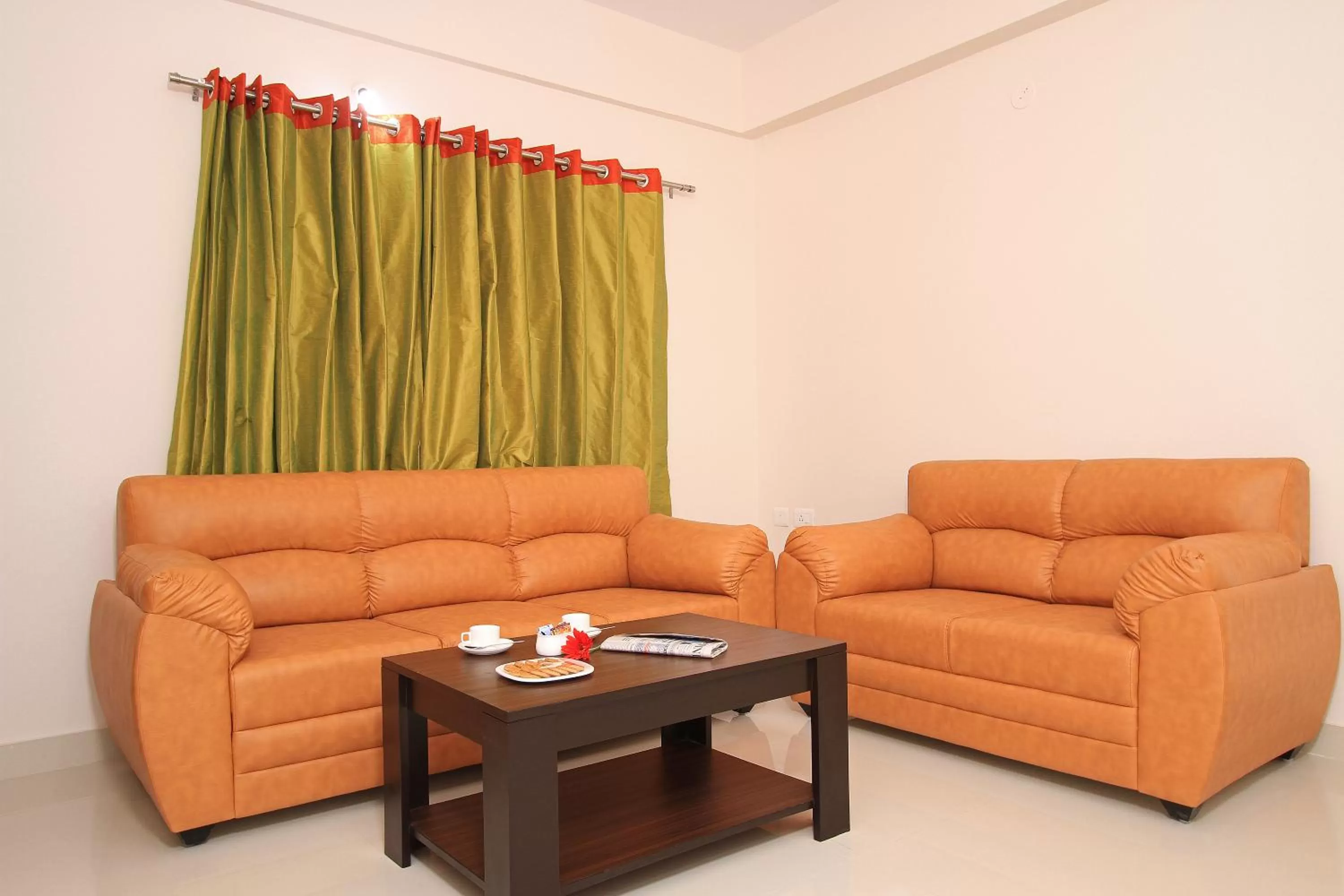 Seating area in Arra Suites kempegowda Airport Hotel