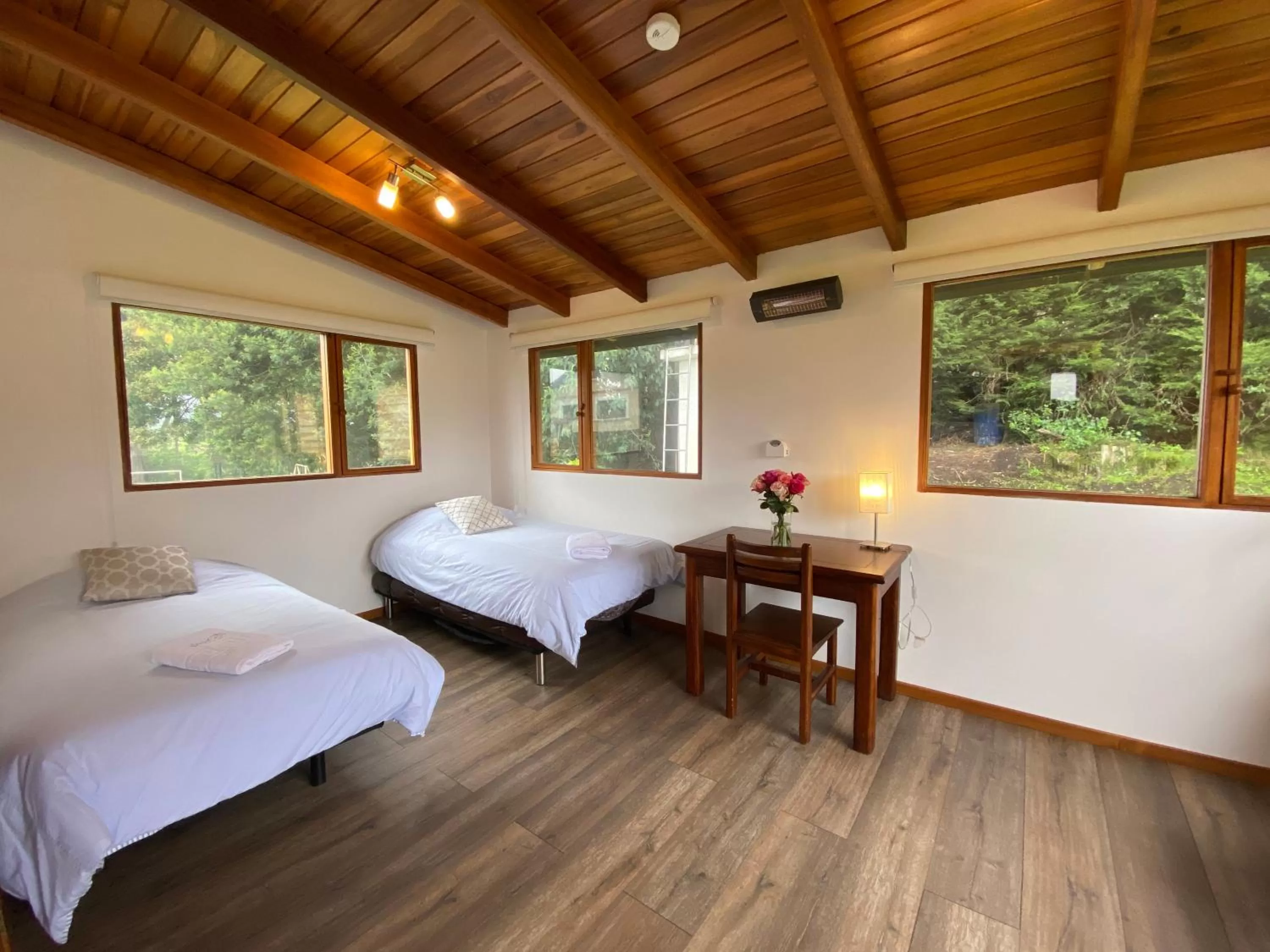 Bed in Hosteria Papagayo Cotopaxi