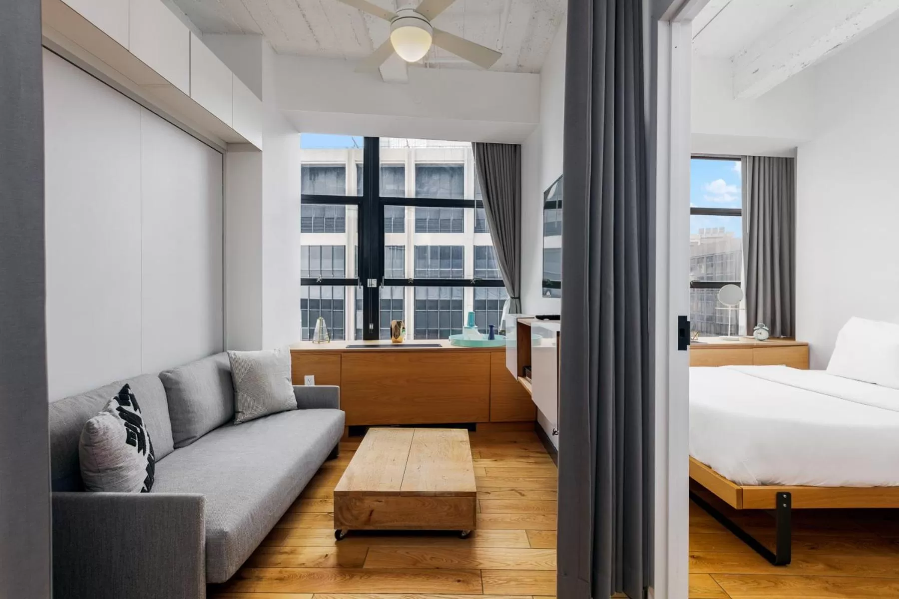 Living room, Bed in Placemakr Wall Street