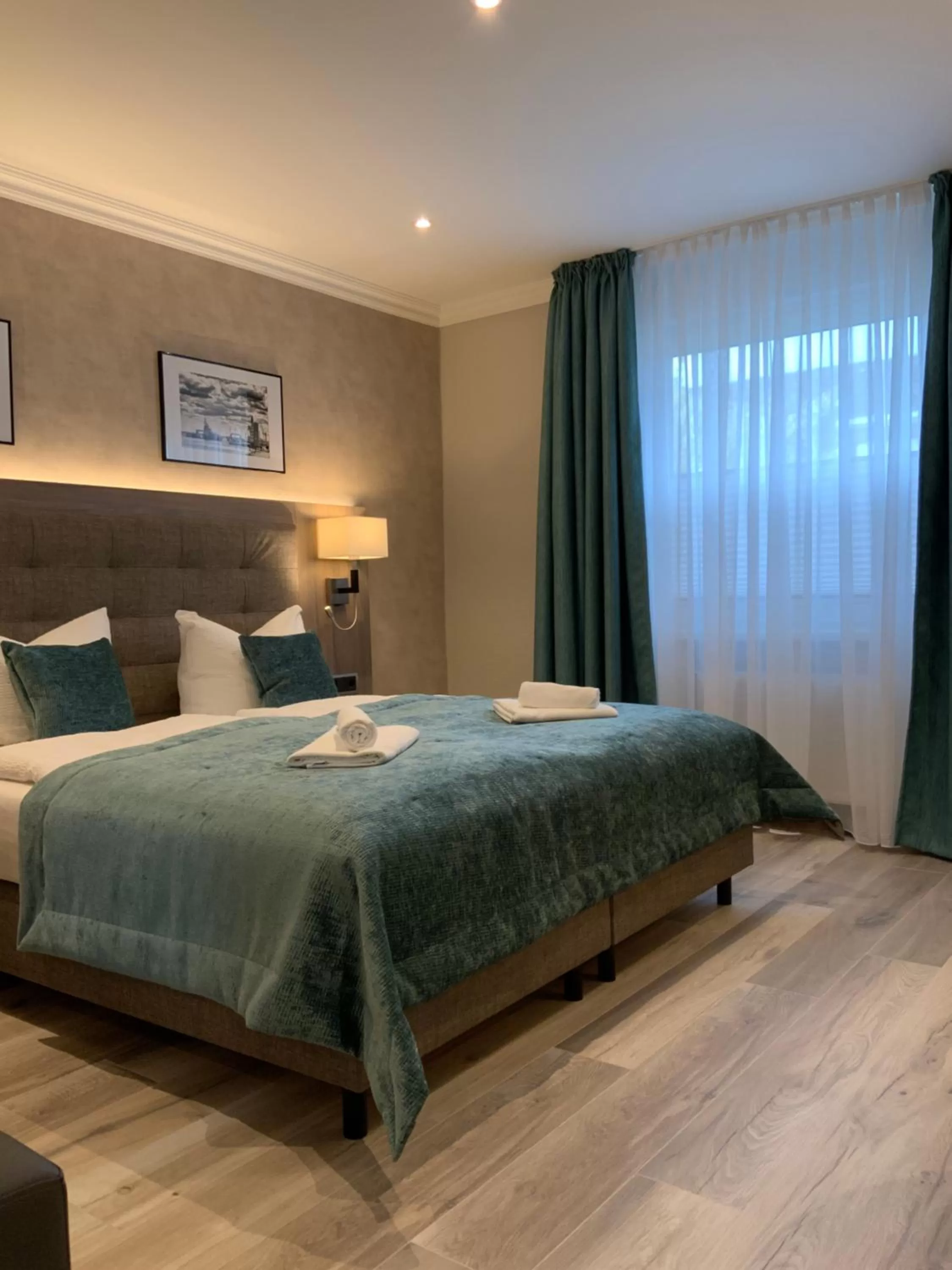 Photo of the whole room, Bed in Mertinkus Nordseehotel