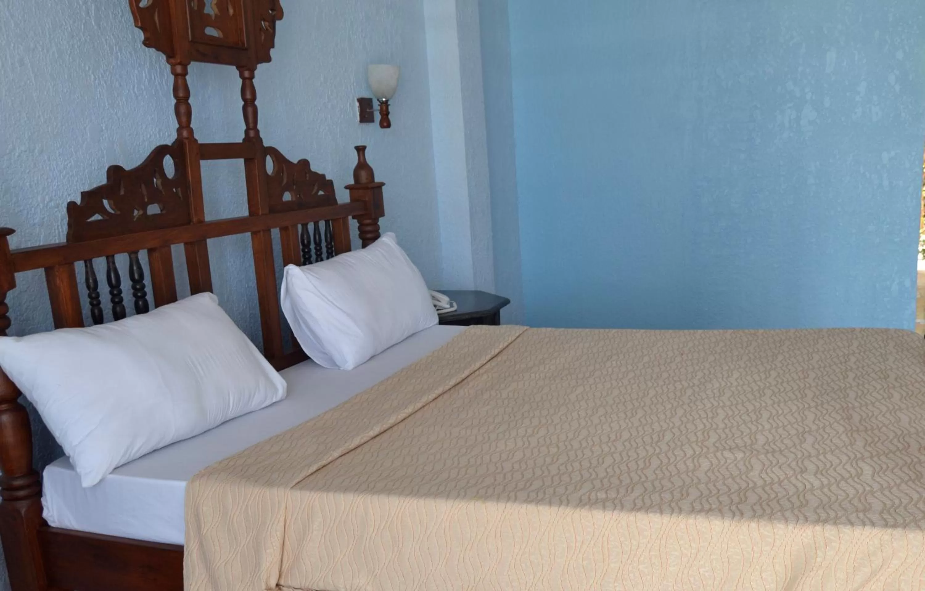 Bed in Serene Beach Resort