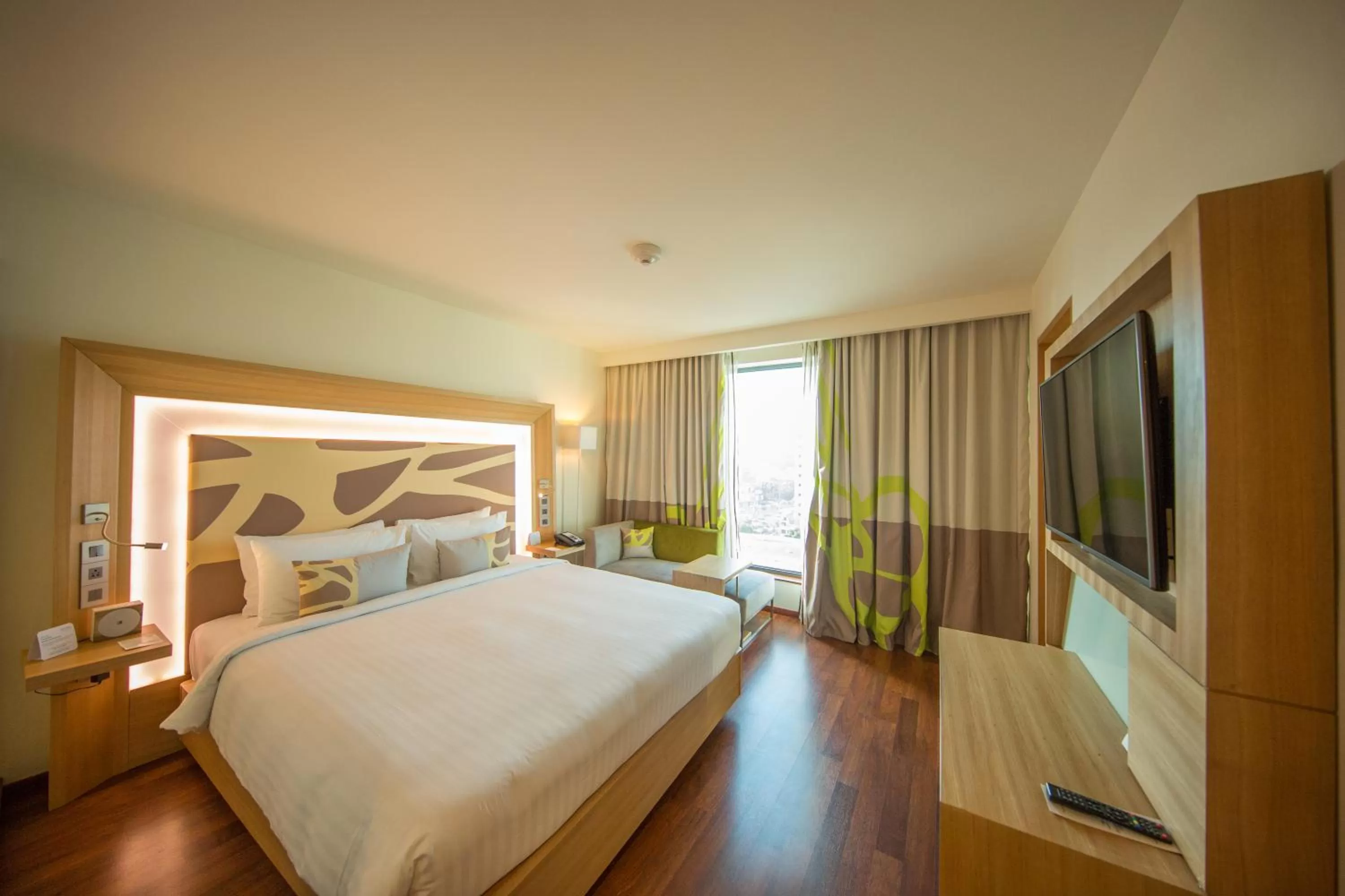 Photo of the whole room, Bed in Novotel Chennai OMR