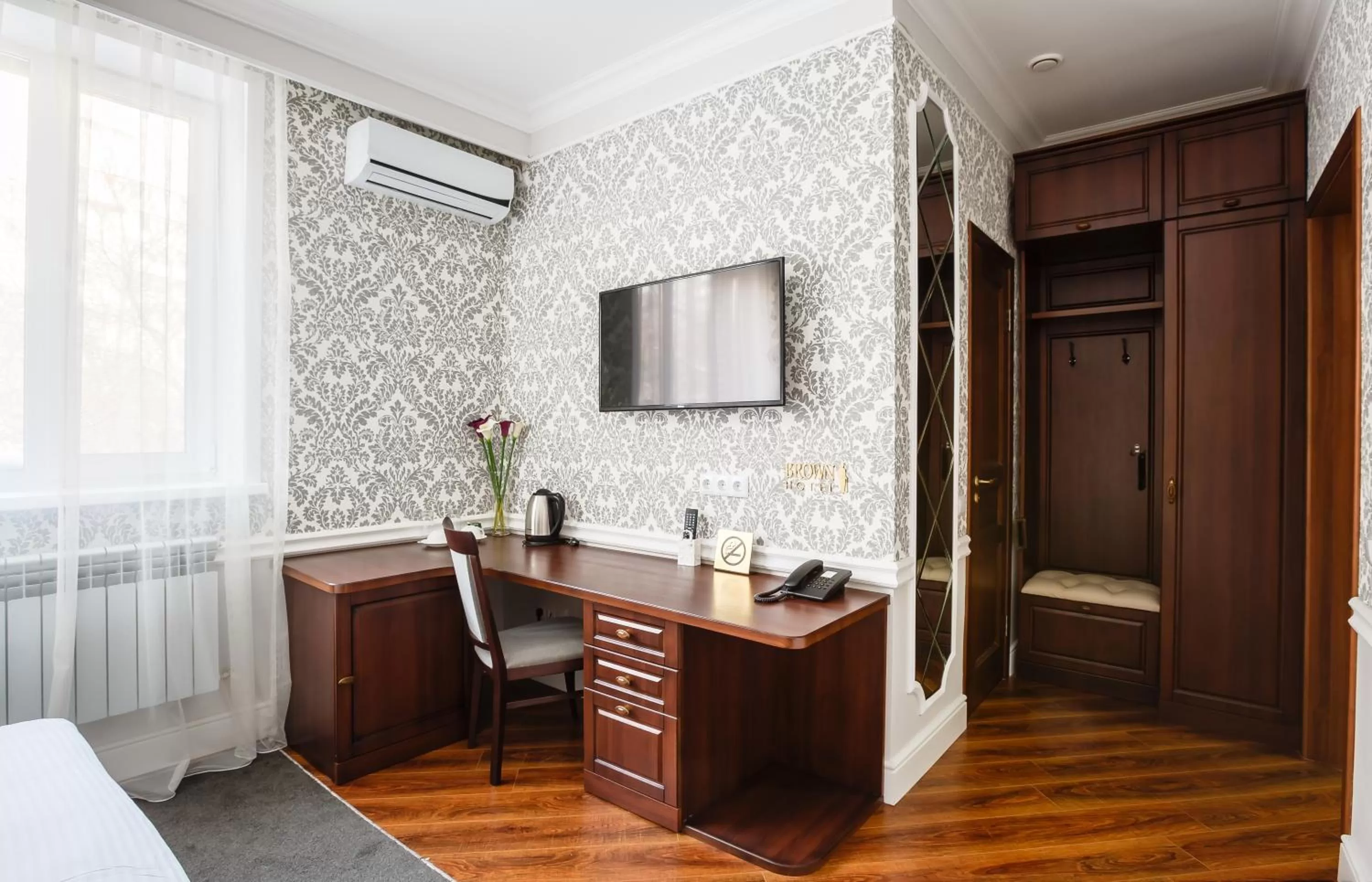 Seating area, Bed in Brown Hotel