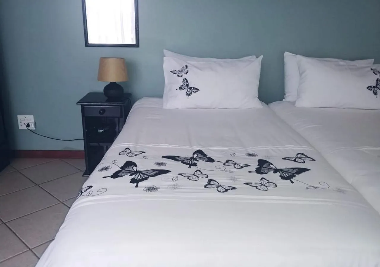 Bed in De Wingerd Wijnland Lodge