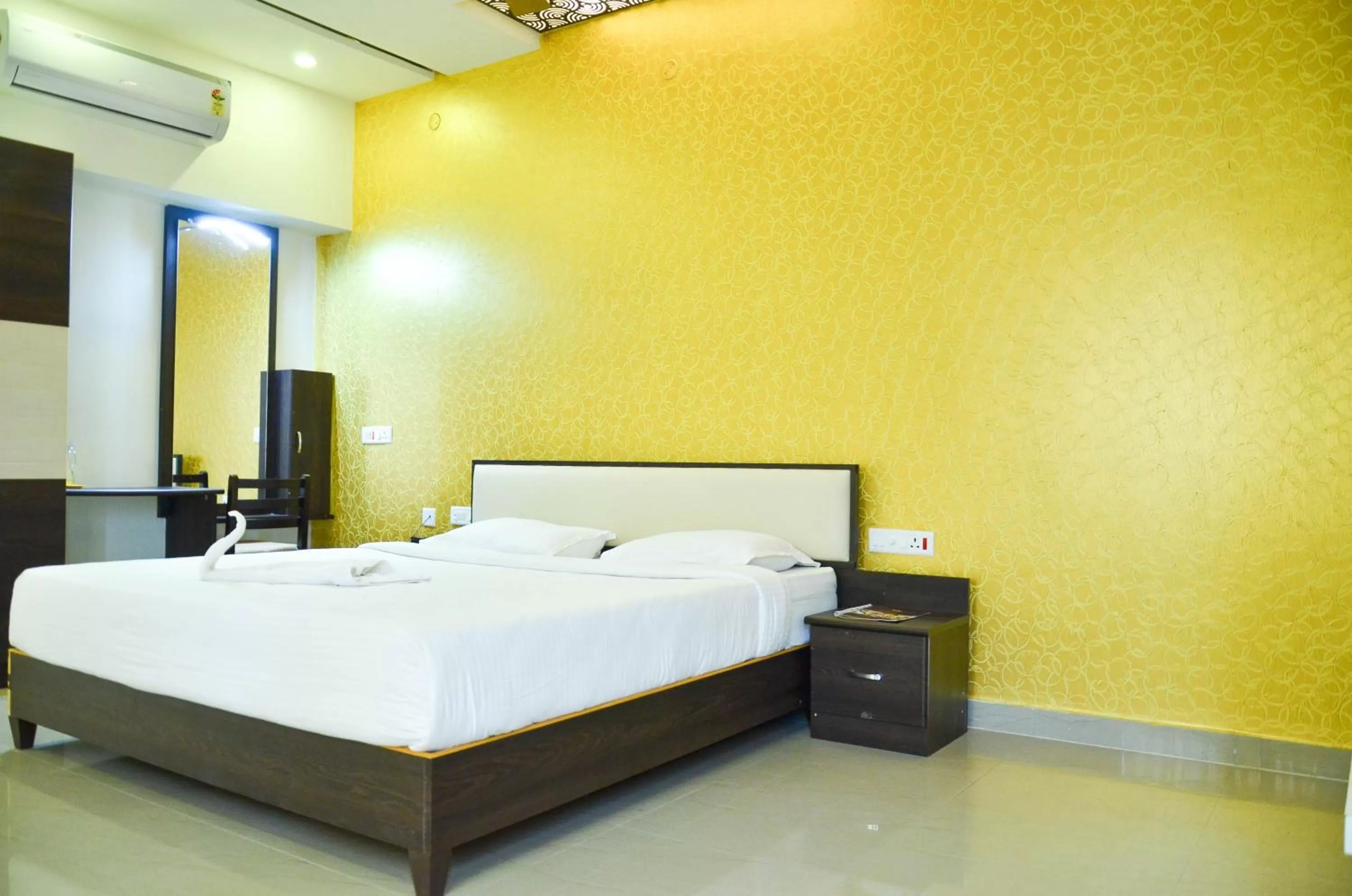 Bed in Hotel Ambai Grand