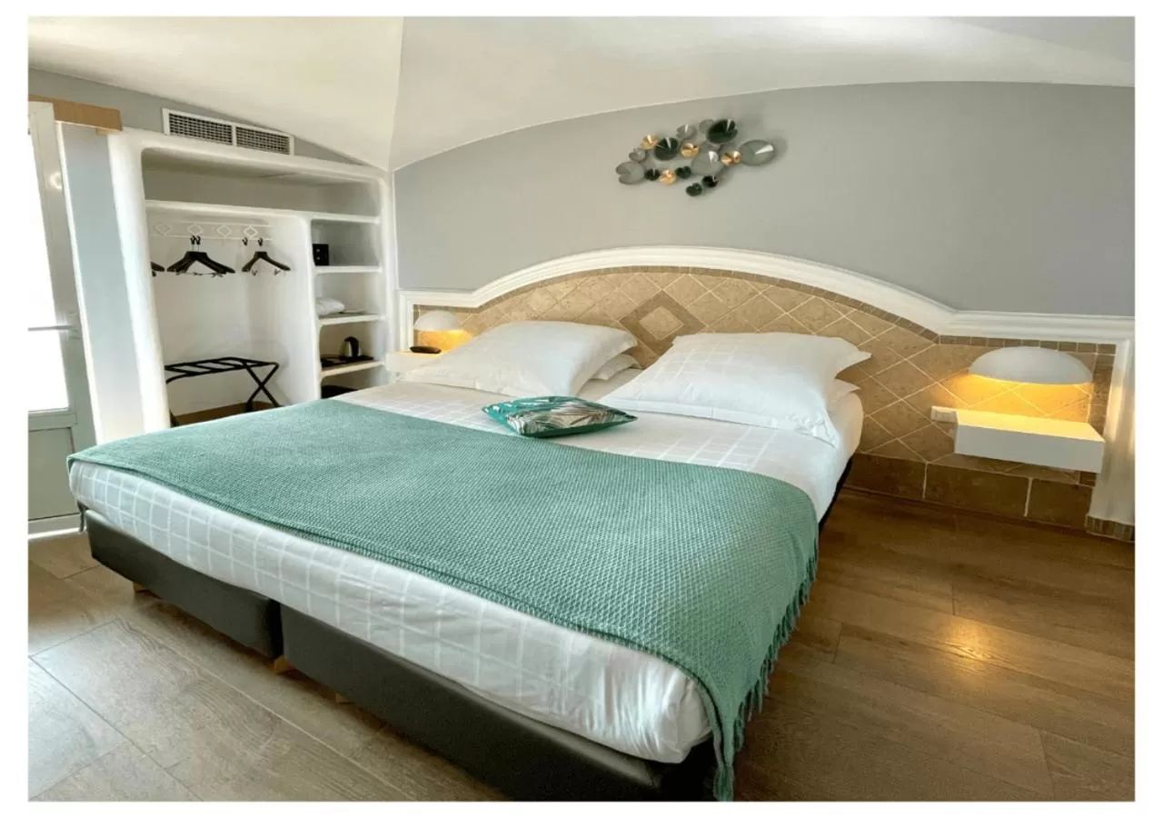 Bed in Ostella Spa & Resort