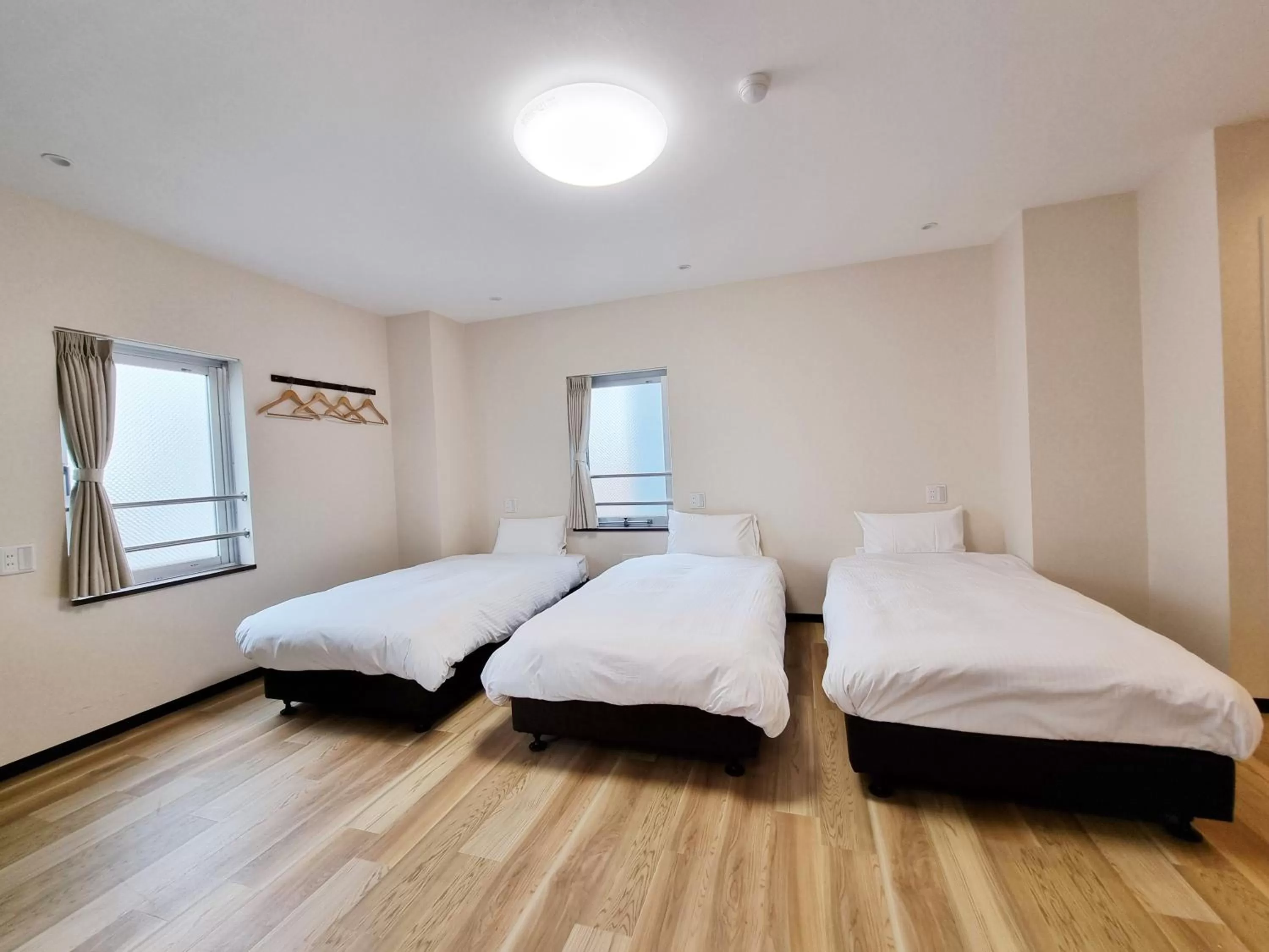 Bed in KYU KYU HOTEL